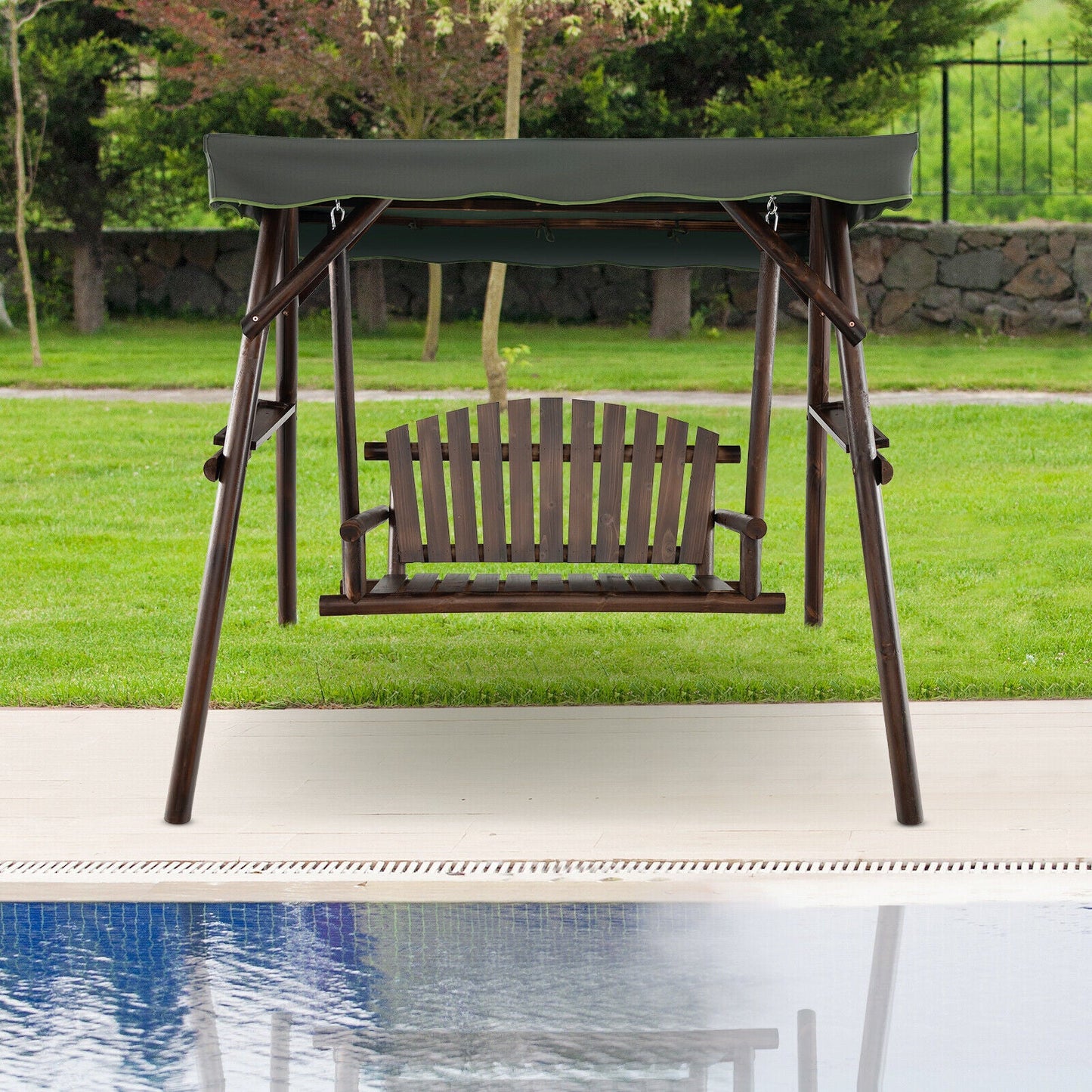 2-Person Outdoor Wooden Porch Swing with an Adjustable Canopy by a pool and green garden