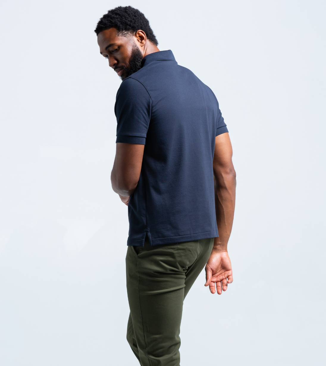 Model wearing the Short Sleeve Perfect Polo showcasing its tailored fit and timeless style from the back view.