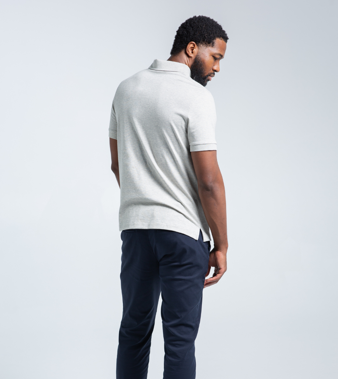 Man wearing Short Sleeve Perfect Polo with StaySharp™ Collar, side view highlighting modern fit and wrinkle-free fabric.