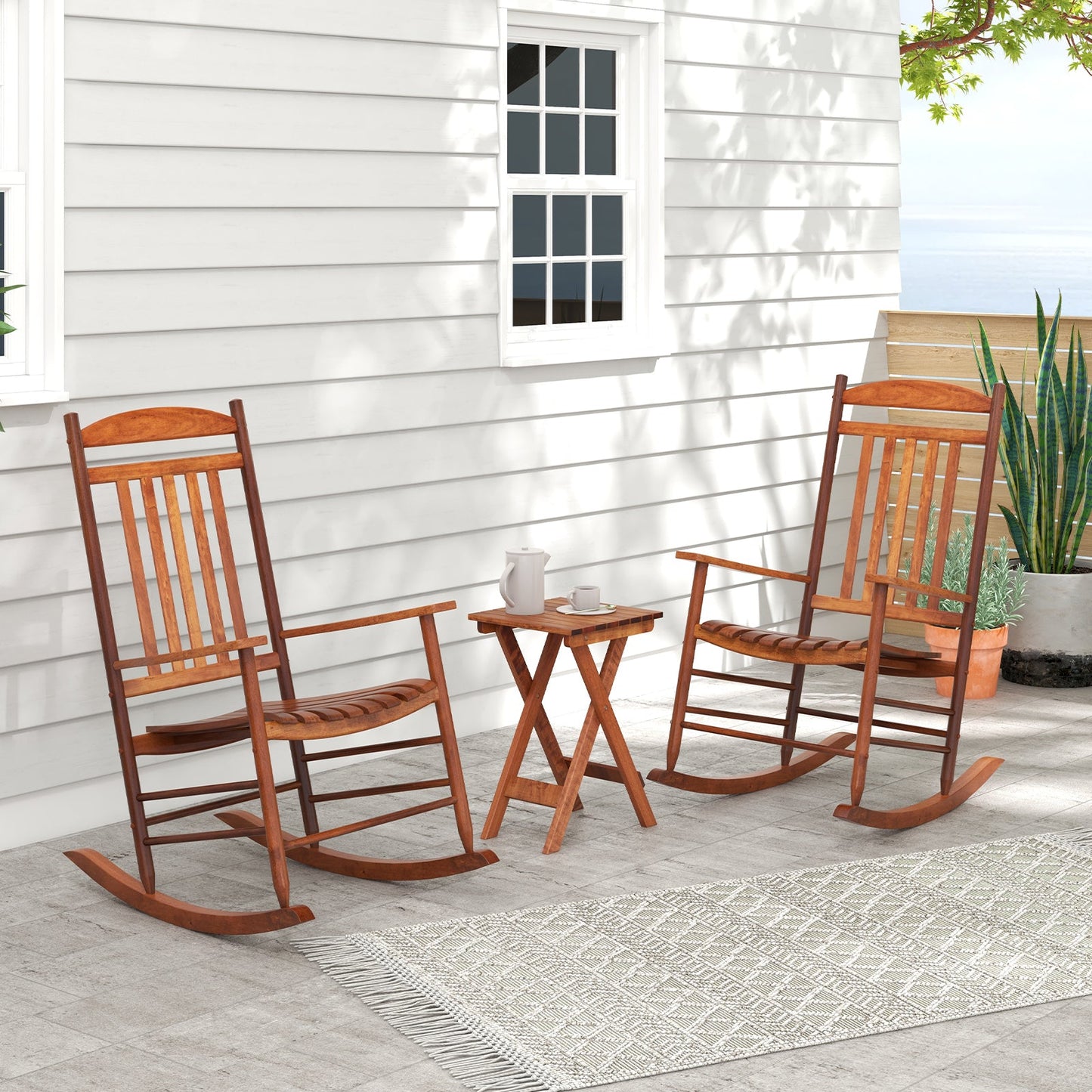 3-piece Outdoor Poplar Wood Rocking Bistro Set-Natural on patio with two chairs and folding table