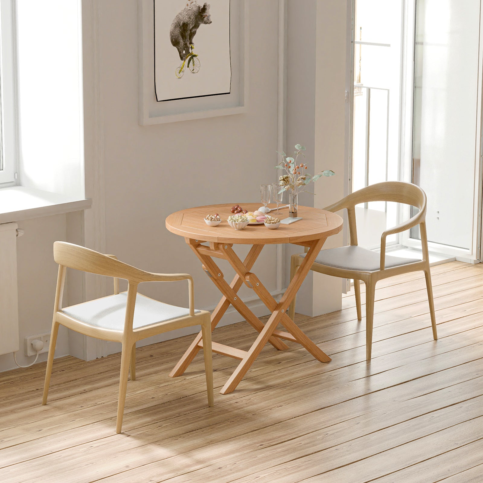 31.5 Inch Folding Patio Indonesia Teak Wood Round Coffee Table with chairs in a sunlit room
