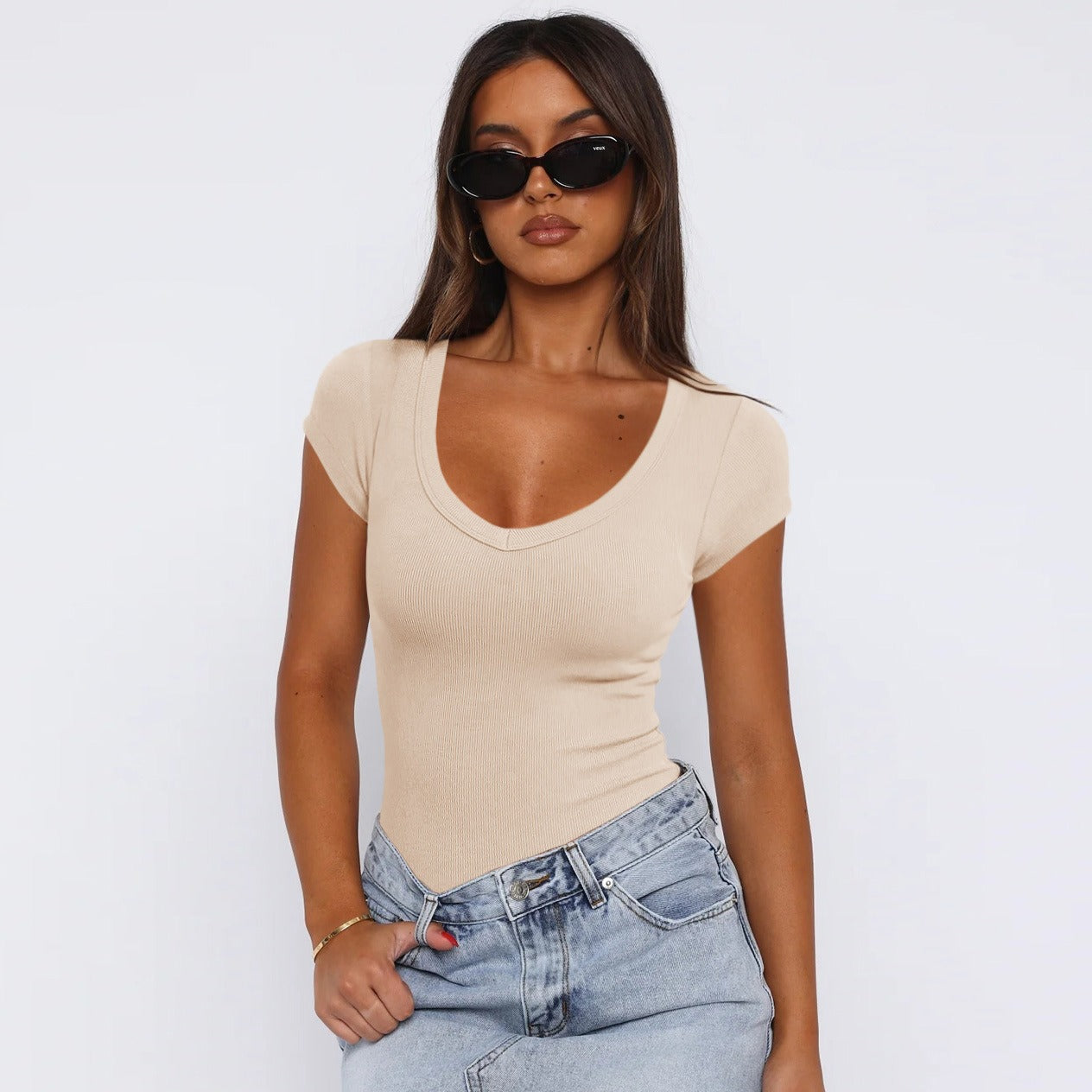 Model wearing an Apricot Saddle Ridge Everyday Tee with jeans, showcasing the versatile and flattering design.