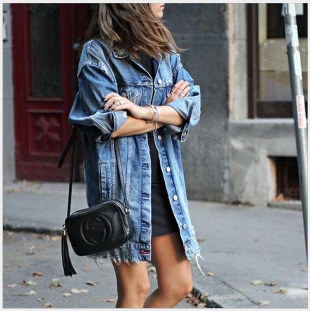 Woman wearing Cowgirl Chic Boyfriend Denim Jacket | Distressed & Stylish Western Outerwear on street