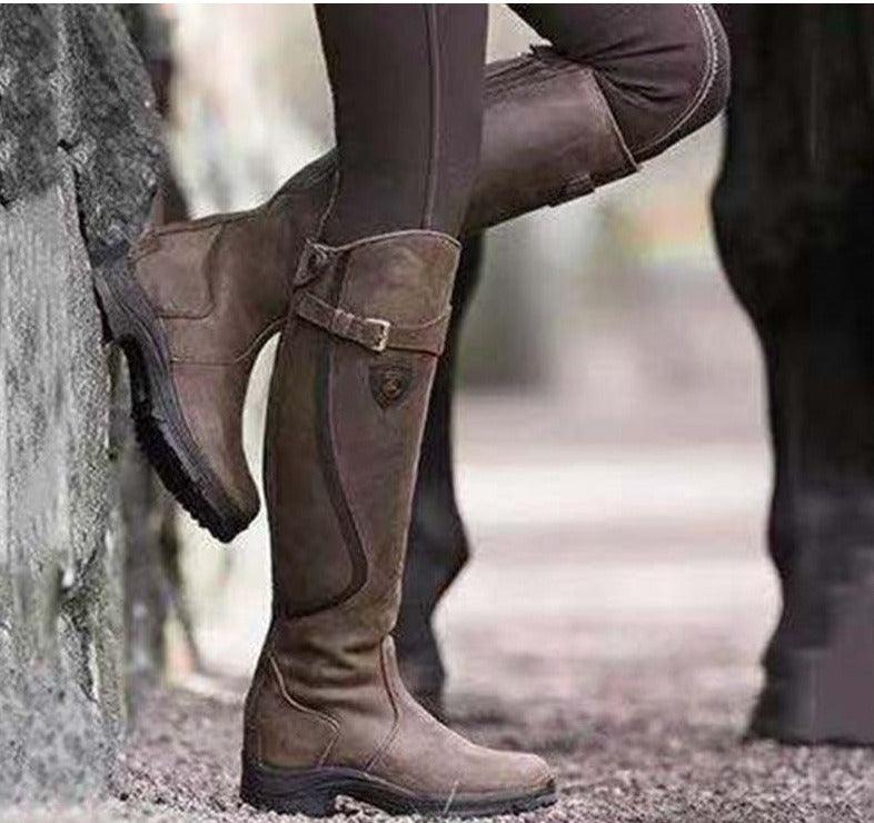 Vintage Ride Leather Boots - Stylish Retro Riding Boots for Trendy Women in Distressed Tan displayed outdoors