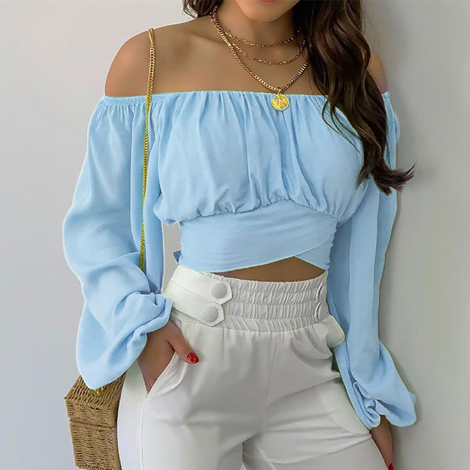 Woman wearing Off Shoulder Cross Tie Long Sleeve Top | Sexy & Trendy Cowgirl Look in light blue with white pants and gold jewelry.