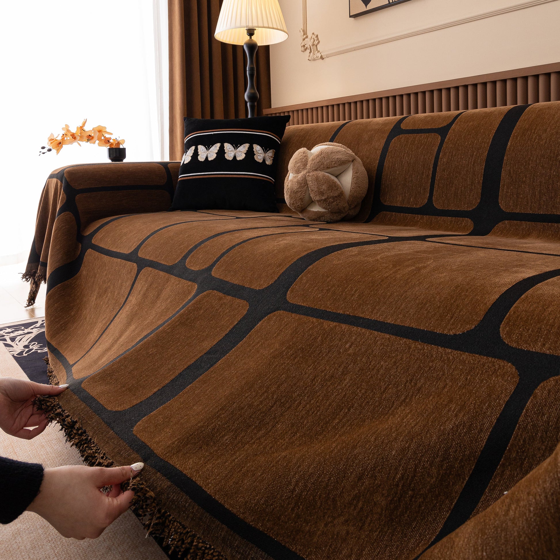 Modern Geometric Sofa Cover Decorative Couch Throw Blanket Furniture Protector in brown chenille with tassel edges on sofa