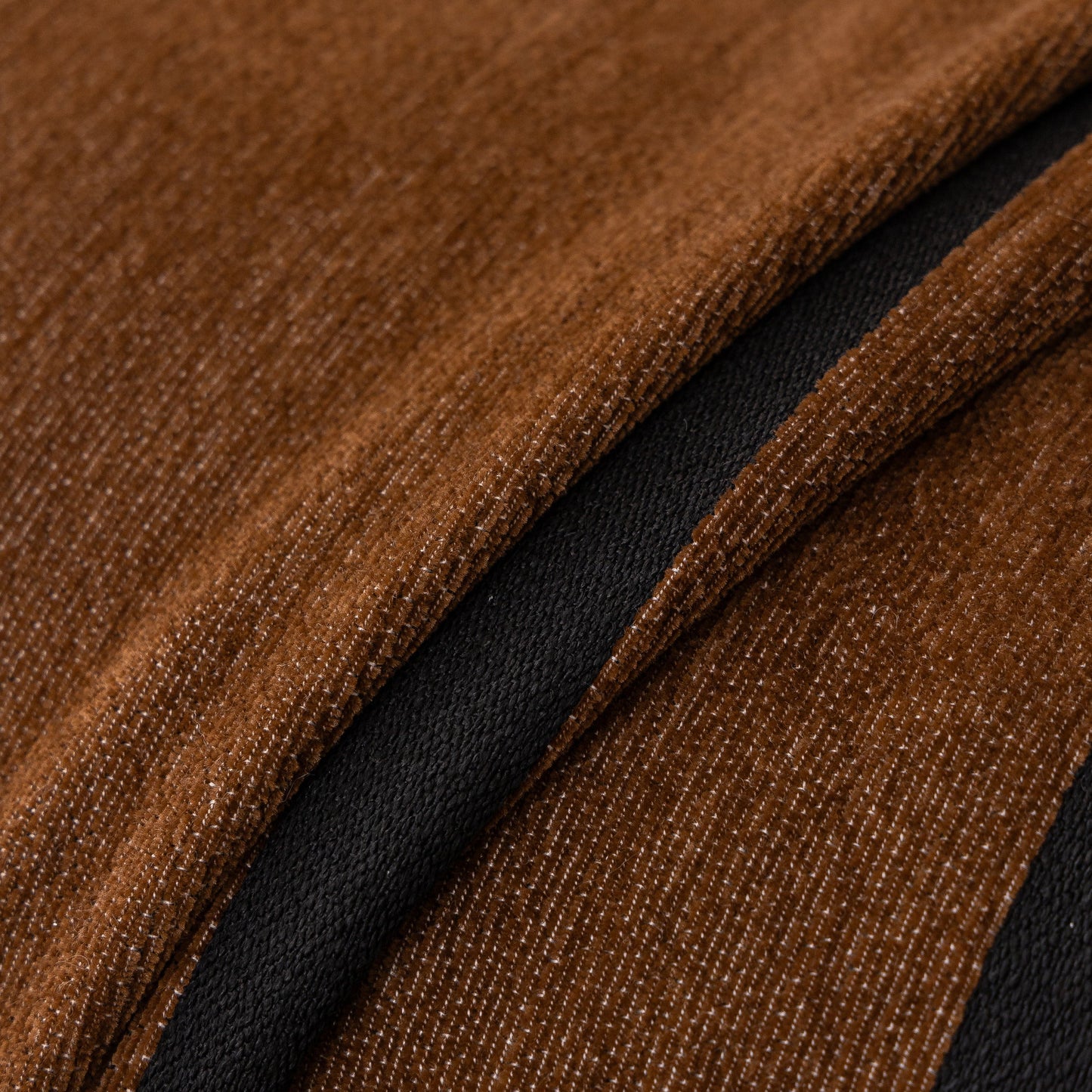 Close-up of Modern Geometric Sofa Cover Decorative Couch Throw Blanket Furniture Protector in brown chenille fabric with texture detail.