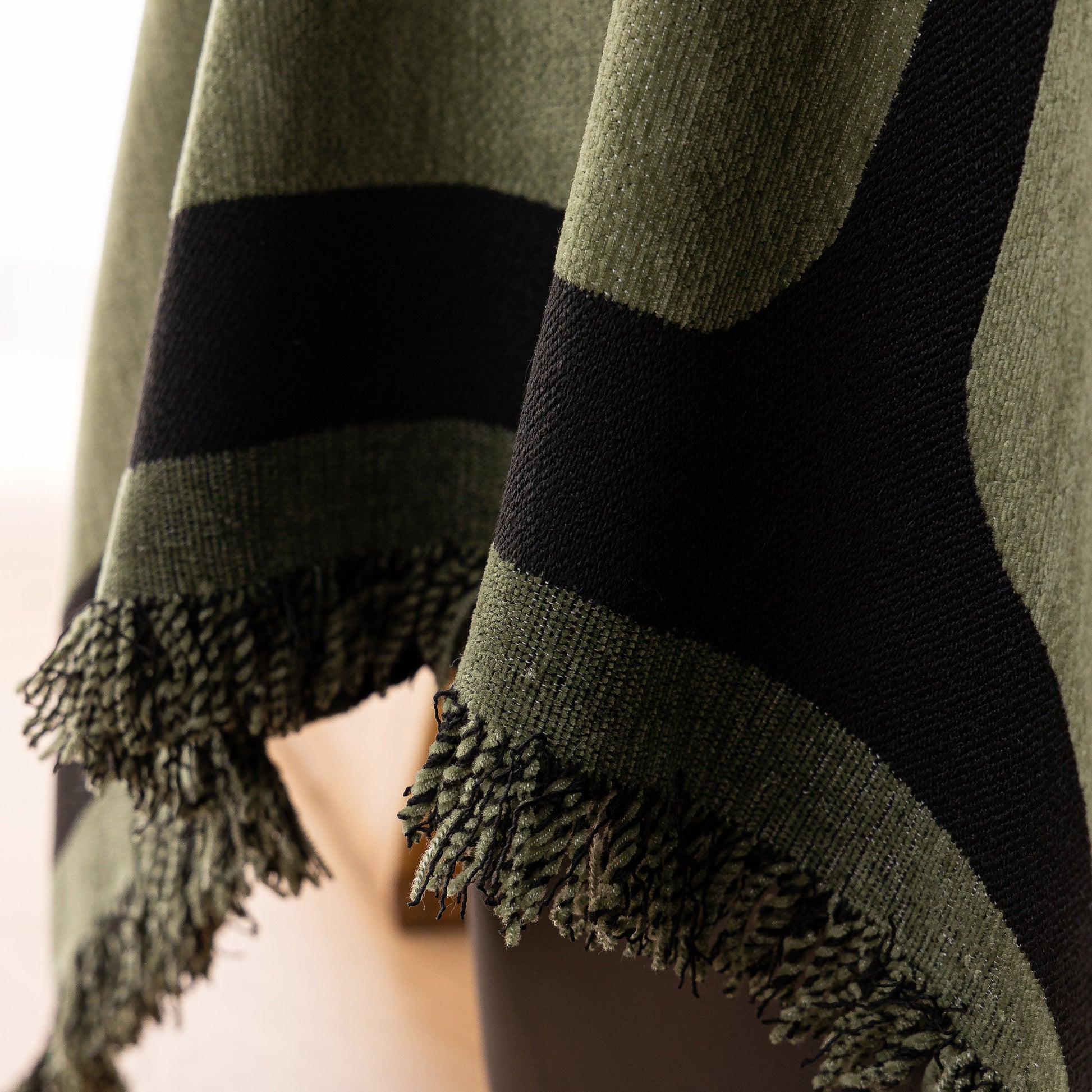Modern Geometric Sofa Cover Decorative Couch Throw Blanket Furniture Protector with tassel edges and geometric pattern in green and black.