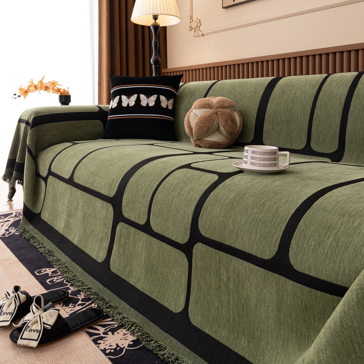 Modern Geometric Sofa Cover Decorative Couch Throw Blanket Furniture Protector with green and black geometric pattern on a sofa.