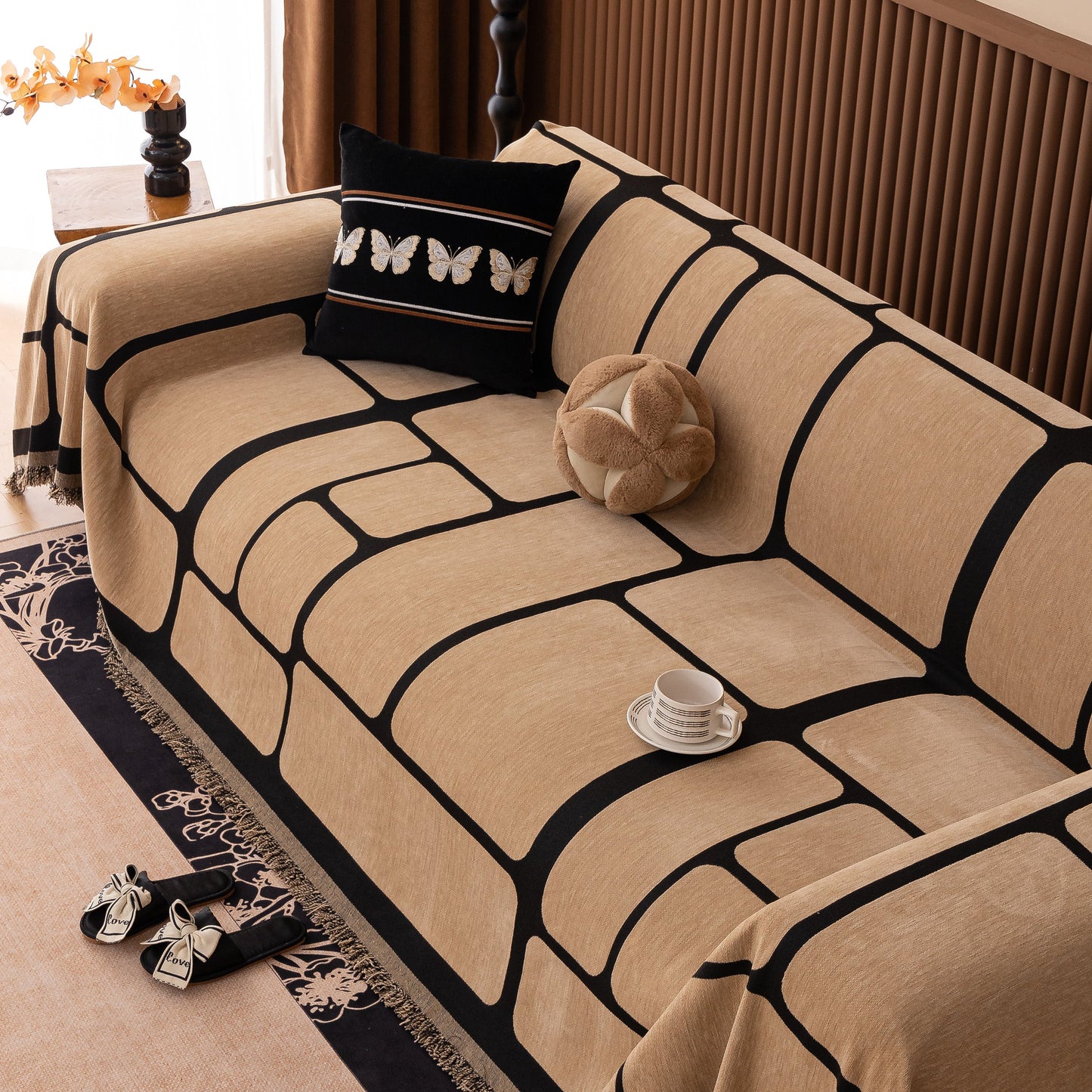 Modern Geometric Sofa Cover Decorative Couch Throw Blanket Furniture Protector on a living room sofa with tassel edges
