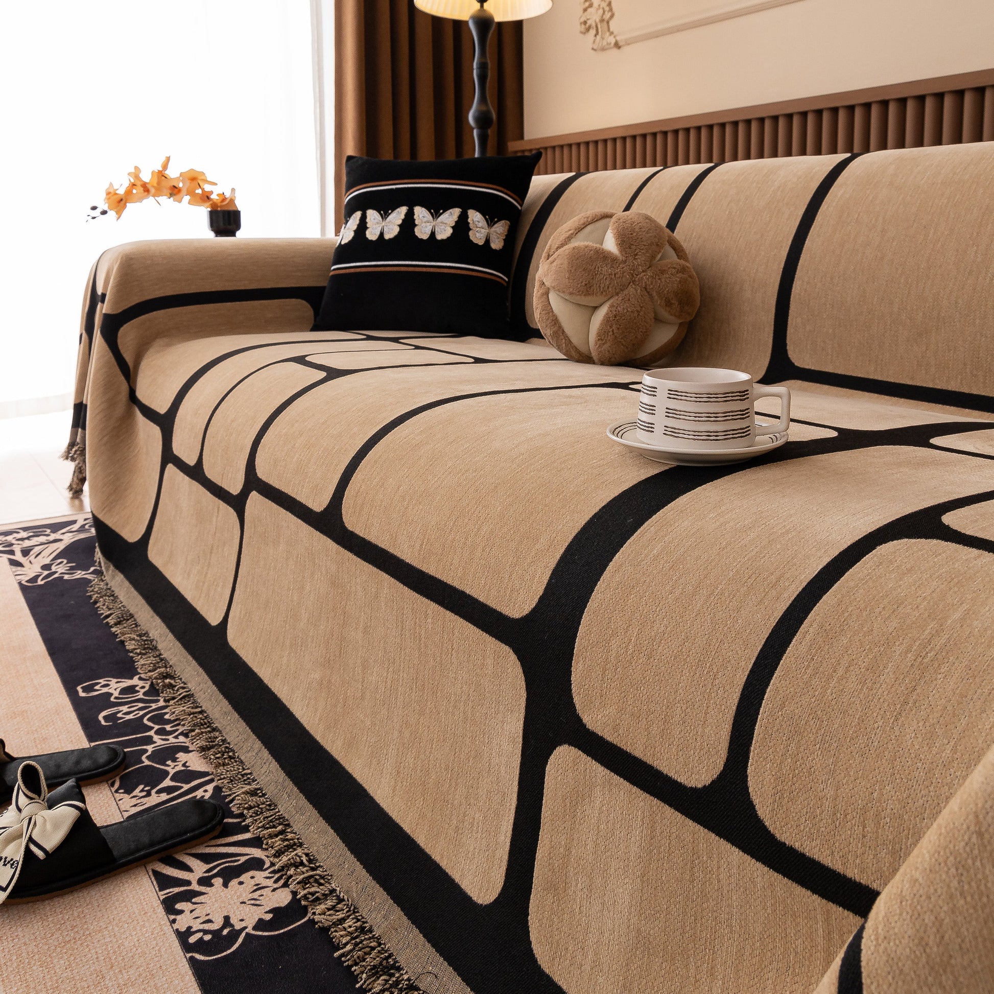 Modern Geometric Sofa Cover Decorative Couch Throw Blanket Furniture Protector in chenille fabric with tassel edges on a sofa.