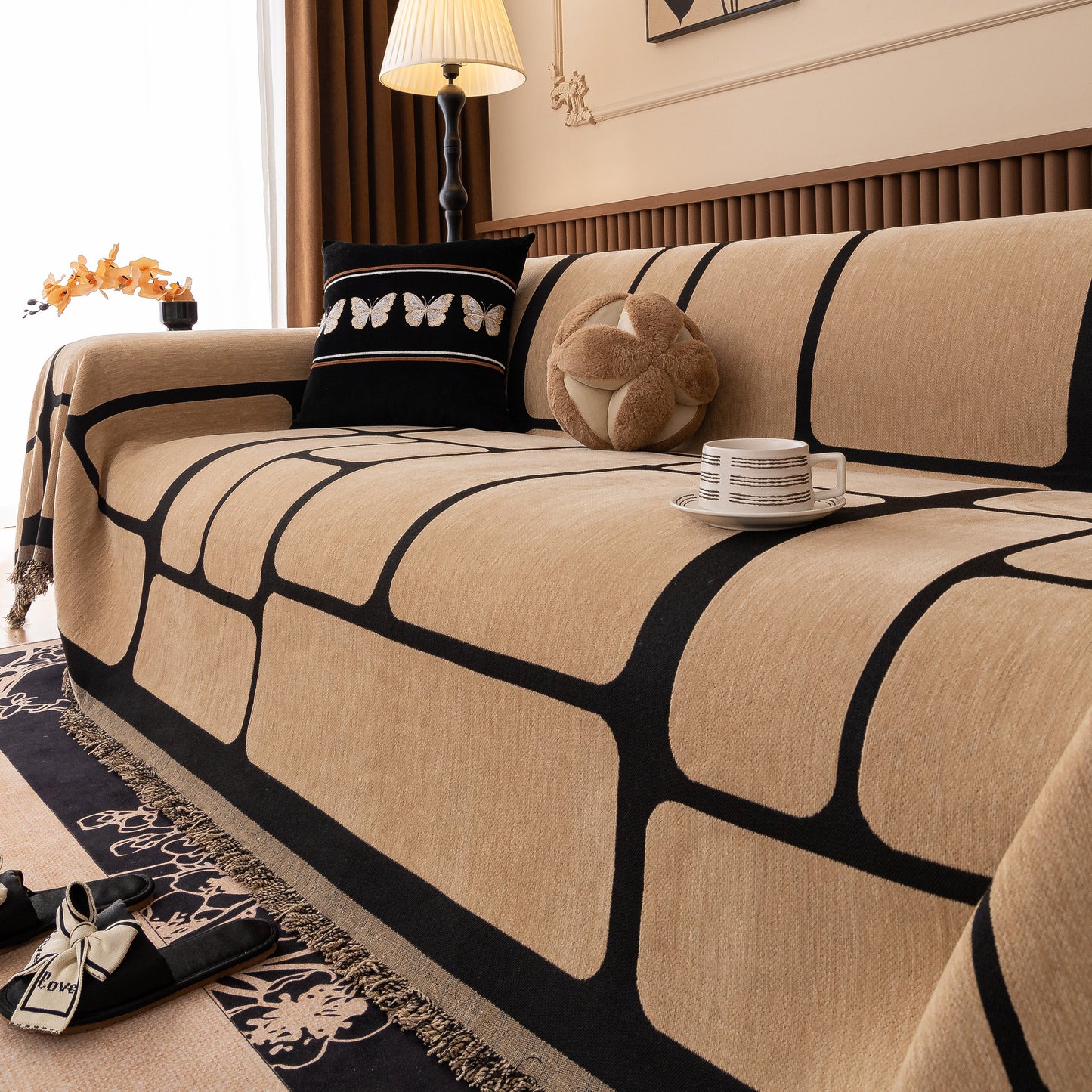 Modern Geometric Sofa Cover Decorative Couch Throw Blanket Furniture Protector with tassel edges on a living room sofa