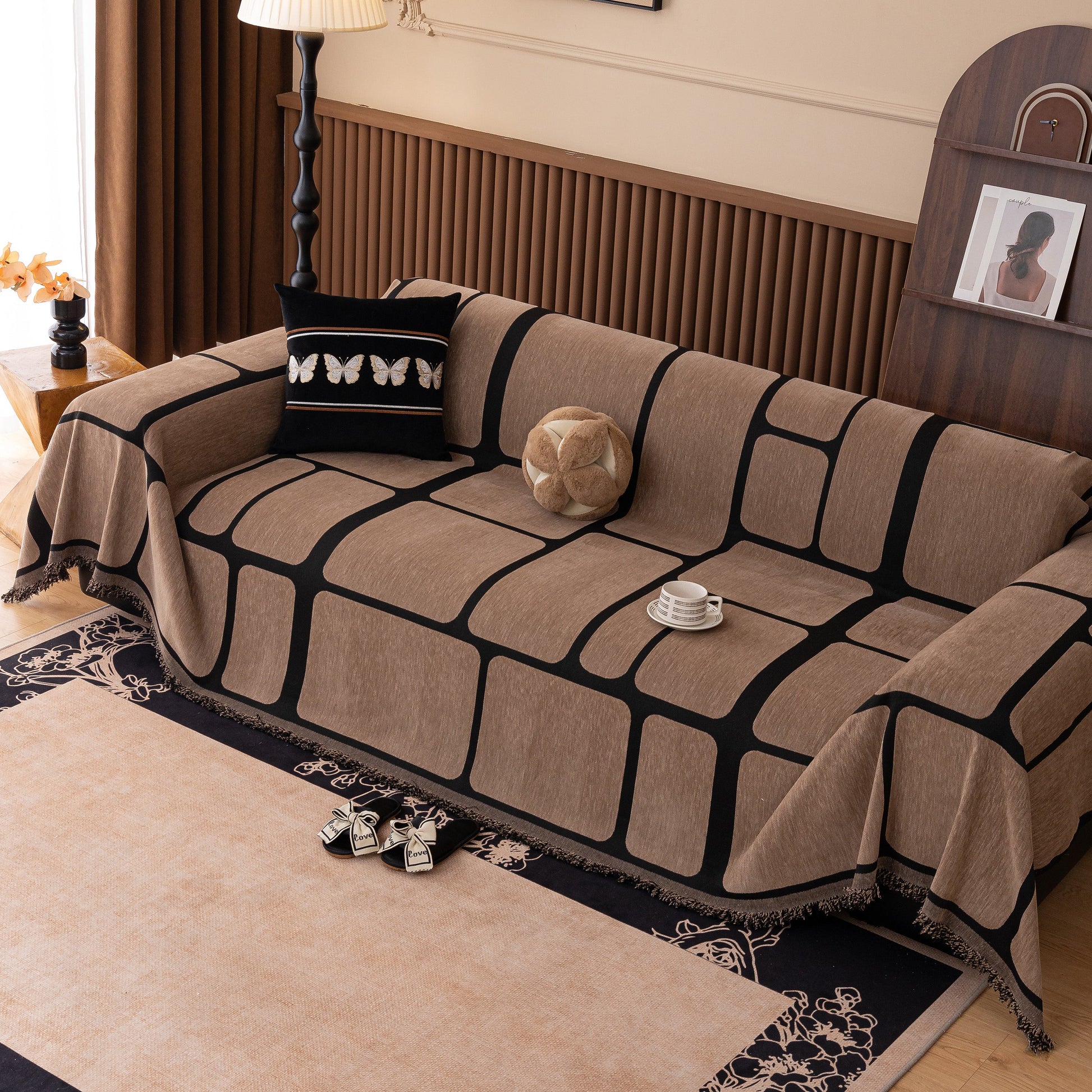 Modern Geometric Sofa Cover Decorative Couch Throw Blanket Furniture Protector in brown and black chenille fabric on a sofa.
