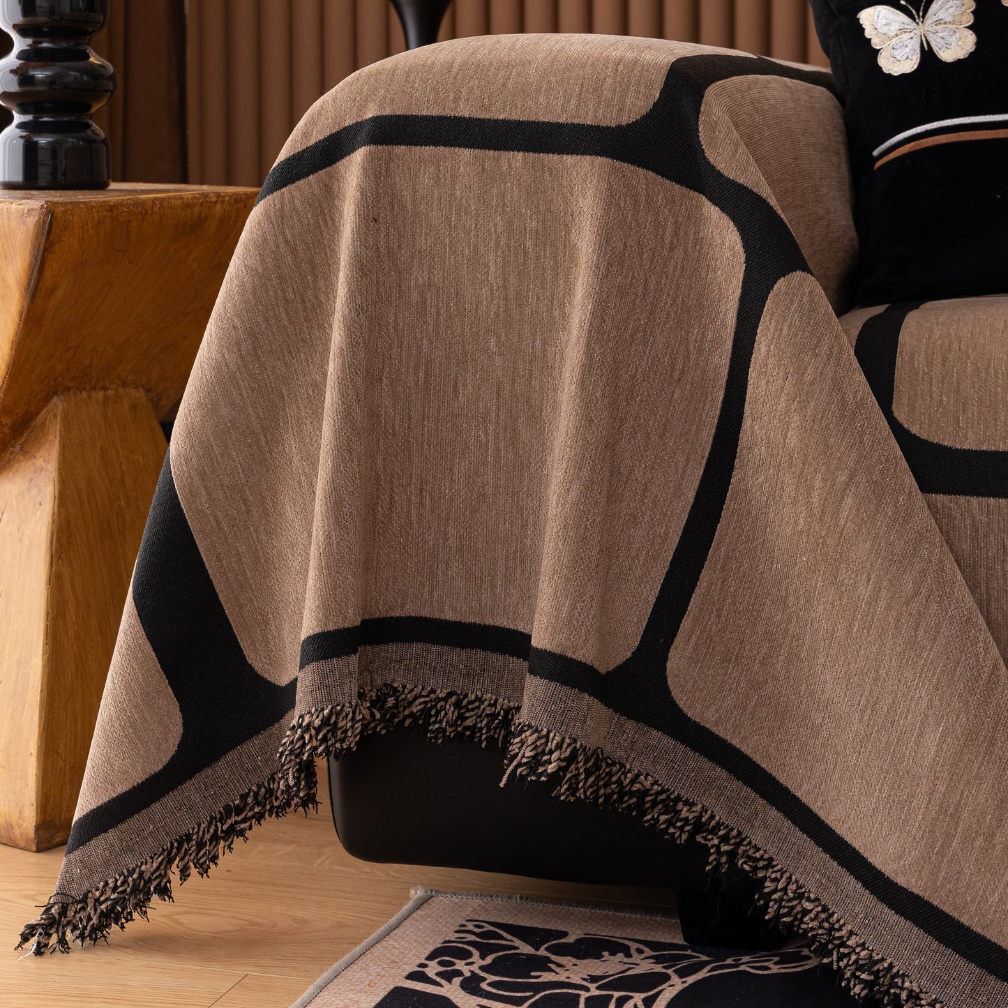 Modern Geometric Sofa Cover Decorative Couch Throw Blanket Furniture Protector with tassel edges on a sofa