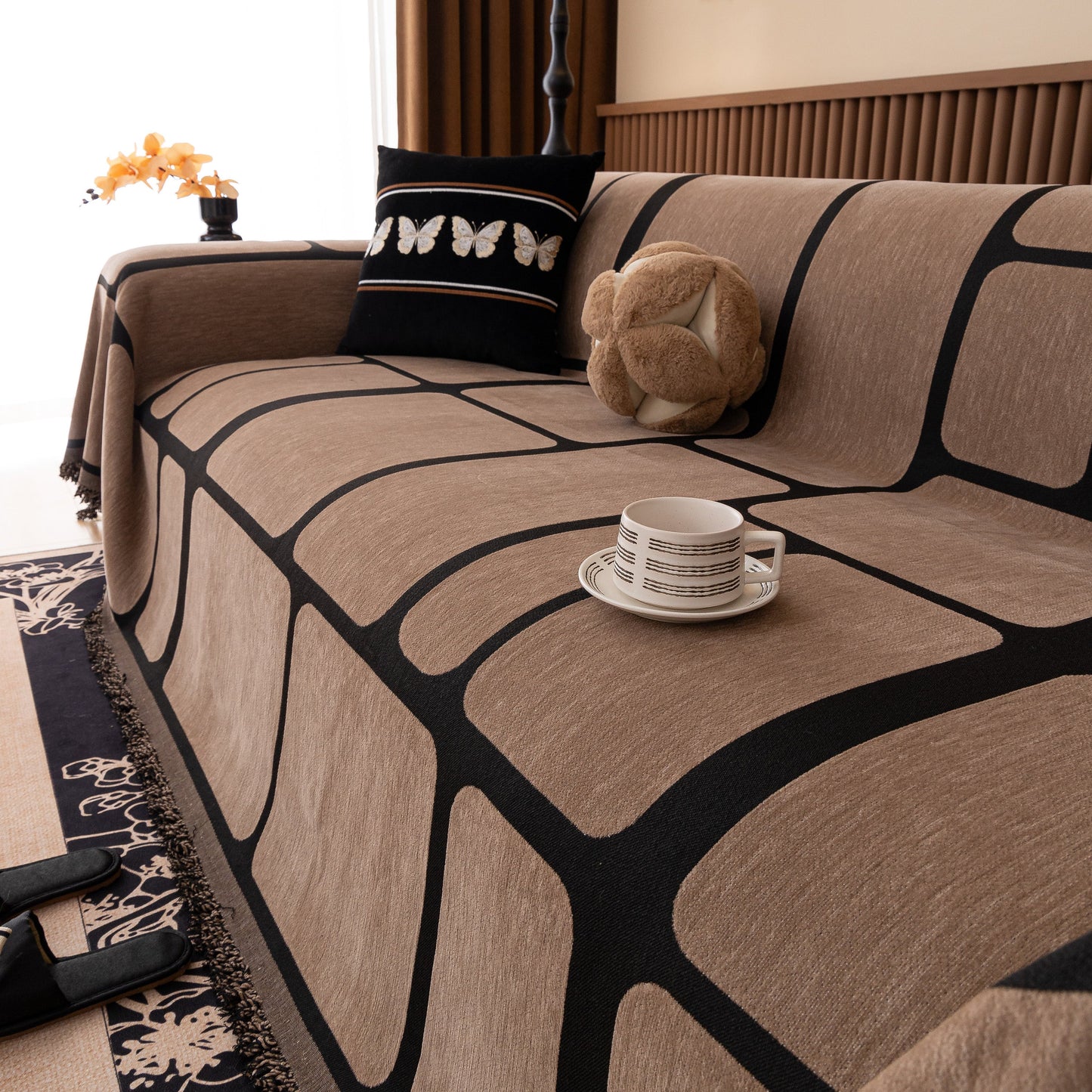 Modern Geometric Sofa Cover Decorative Couch Throw Blanket Furniture Protector with a geometric pattern and tassel edges