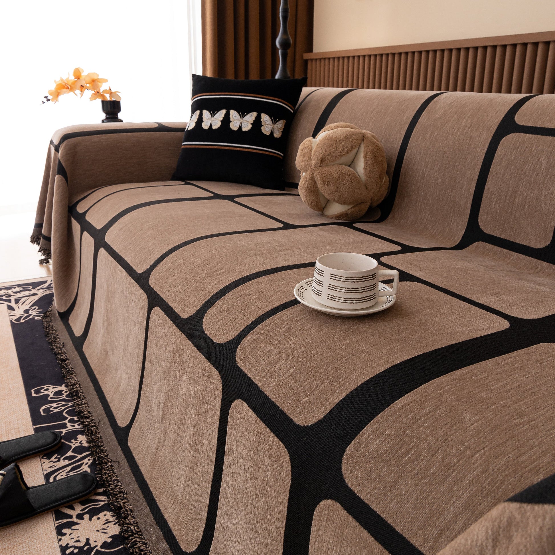 Modern Geometric Sofa Cover Decorative Couch Throw Blanket Furniture Protector with a geometric pattern and tassel edges