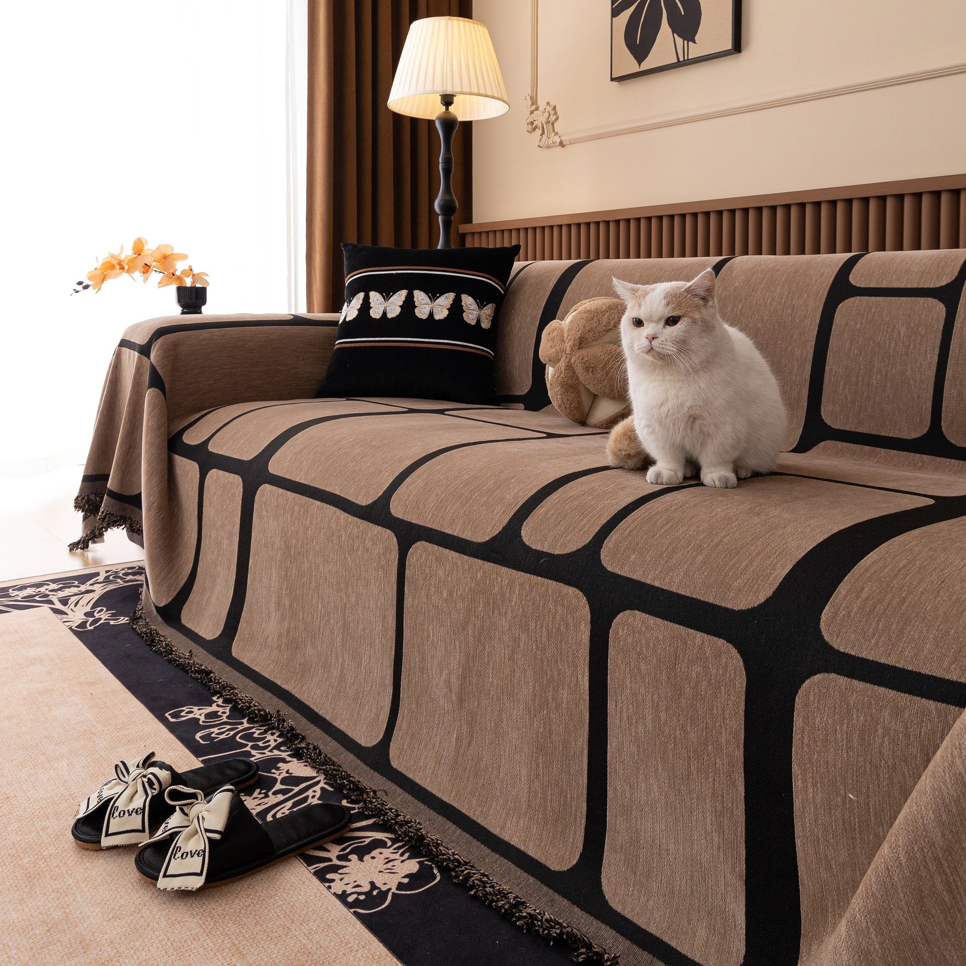 Modern Geometric Sofa Cover Decorative Couch Throw Blanket Furniture Protector draped on sofa with cat sitting on it