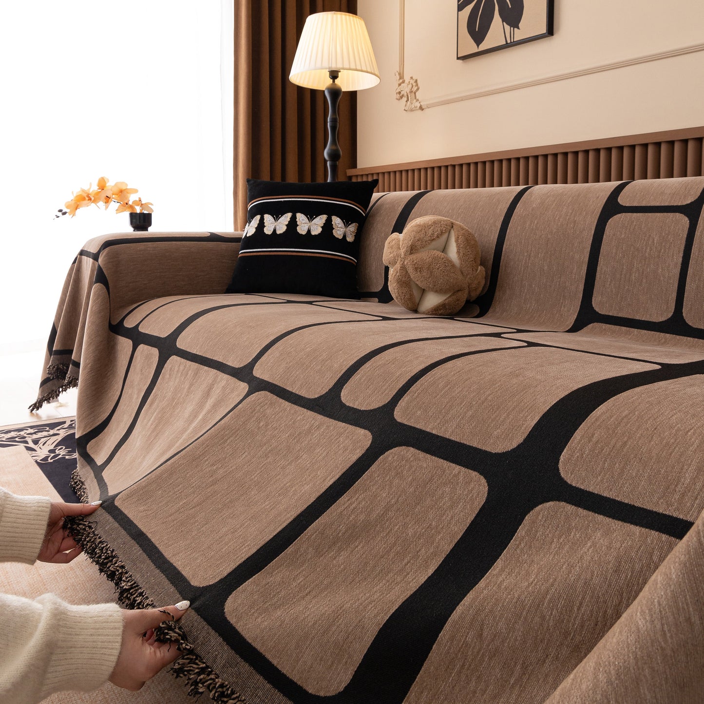 Modern Geometric Sofa Cover Decorative Couch Throw Blanket Furniture Protector with tassel edges in a living room setting