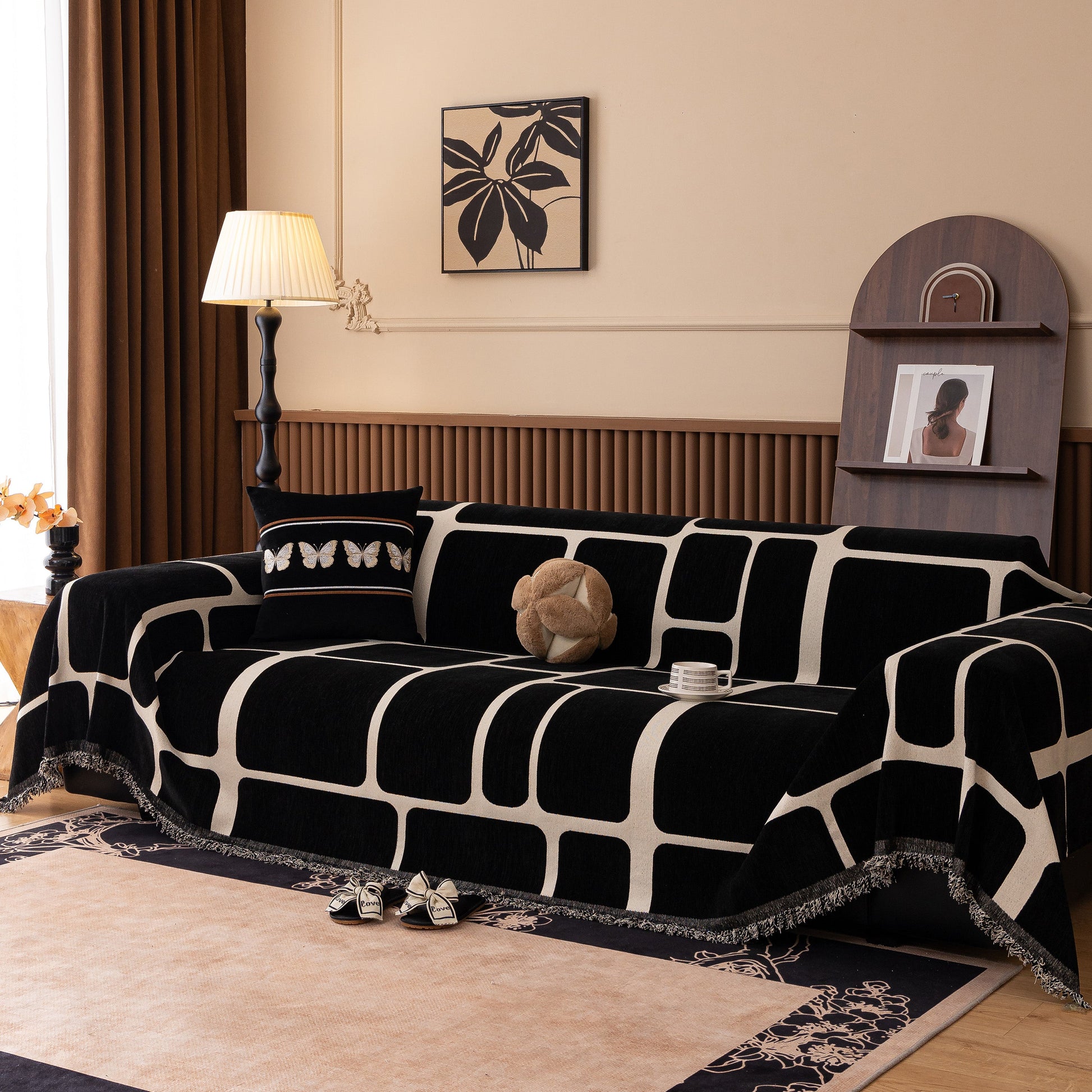 Living room featuring Modern Geometric Sofa Cover Decorative Couch Throw Blanket Furniture Protector in black and white pattern.