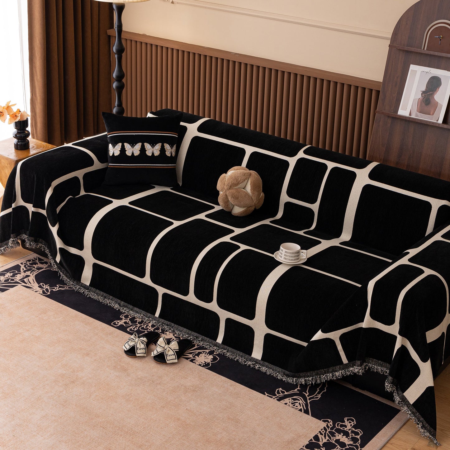 Modern Geometric Sofa Cover Decorative Couch Throw Blanket Furniture Protector made of chenille fabric on a black and white sofa.
