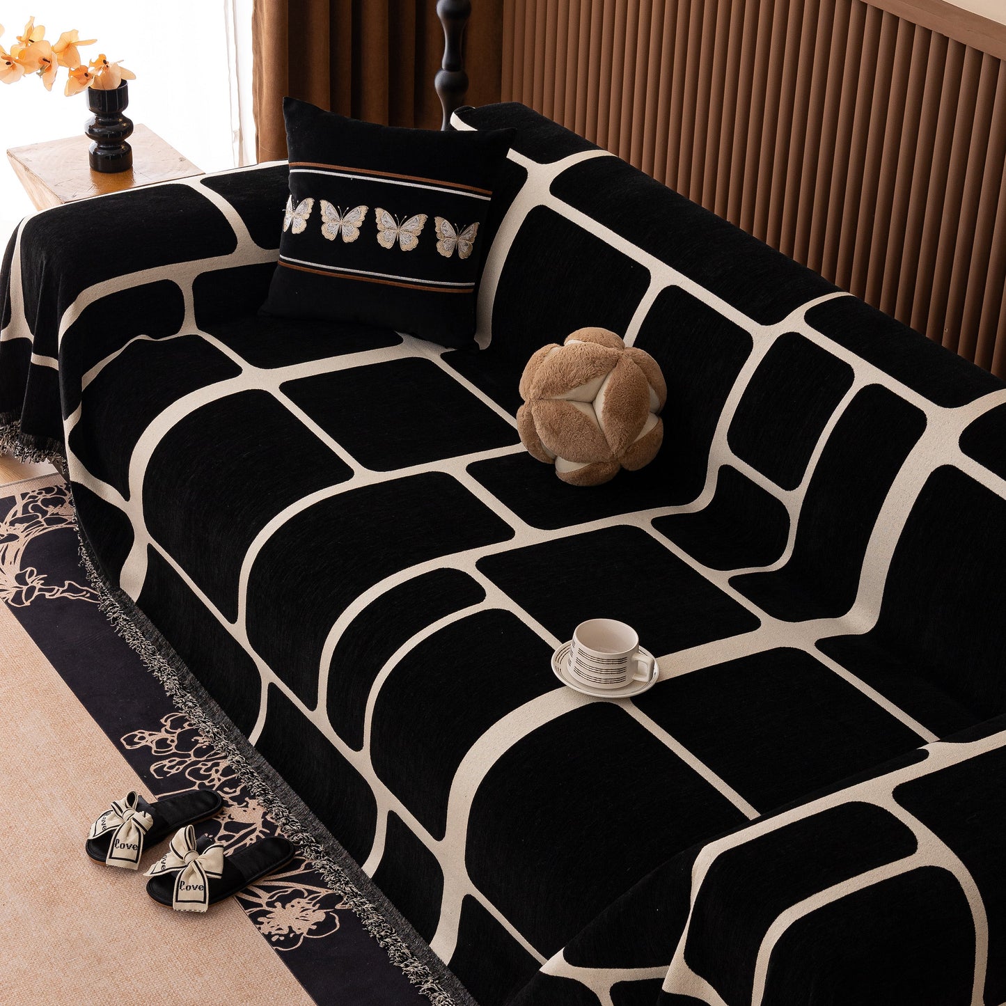 Modern Geometric Sofa Cover Decorative Couch Throw Blanket Furniture Protector with black and white geometric pattern on a sofa