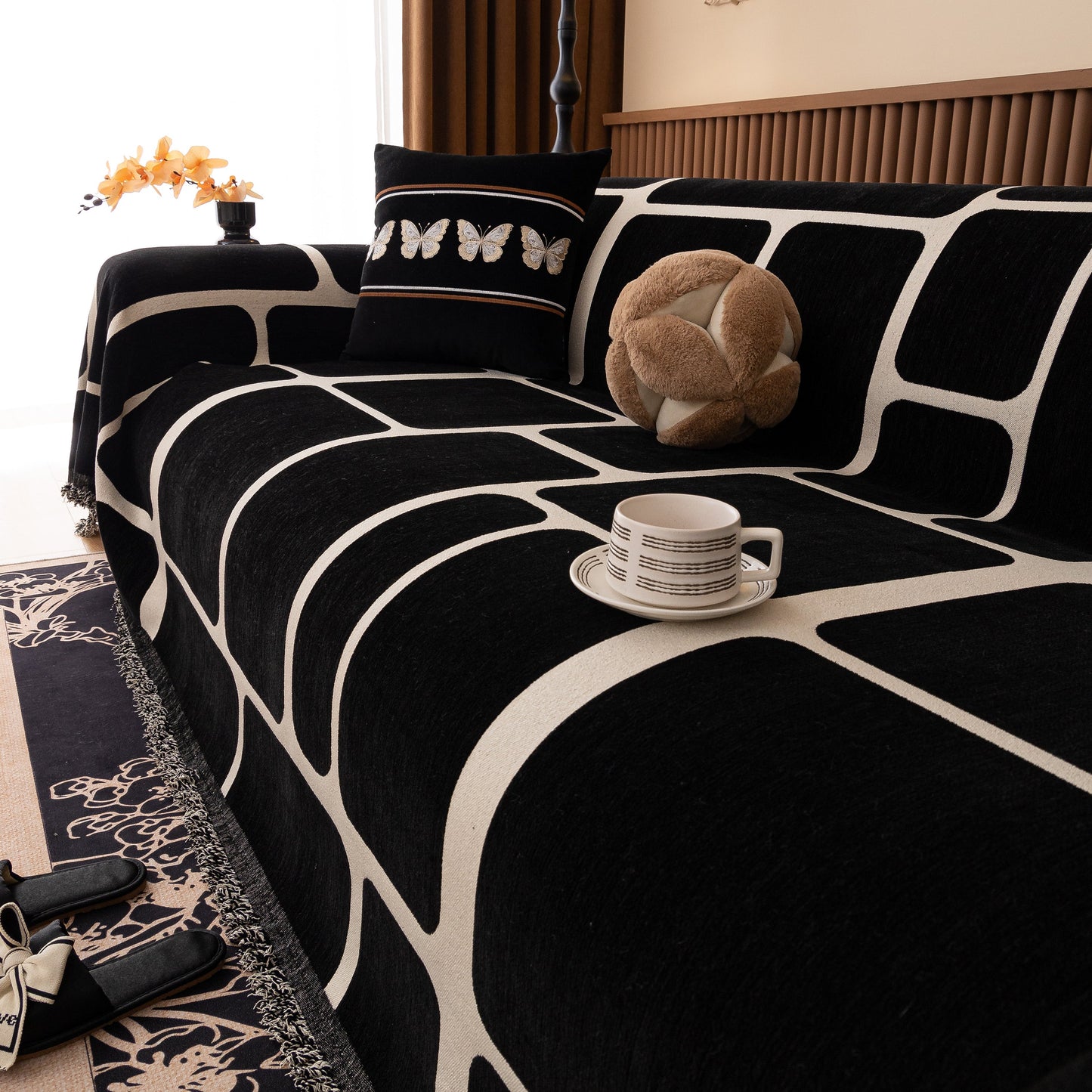 Modern Geometric Sofa Cover Decorative Couch Throw Blanket Furniture Protector with tassel edges and geometric pattern on couch.