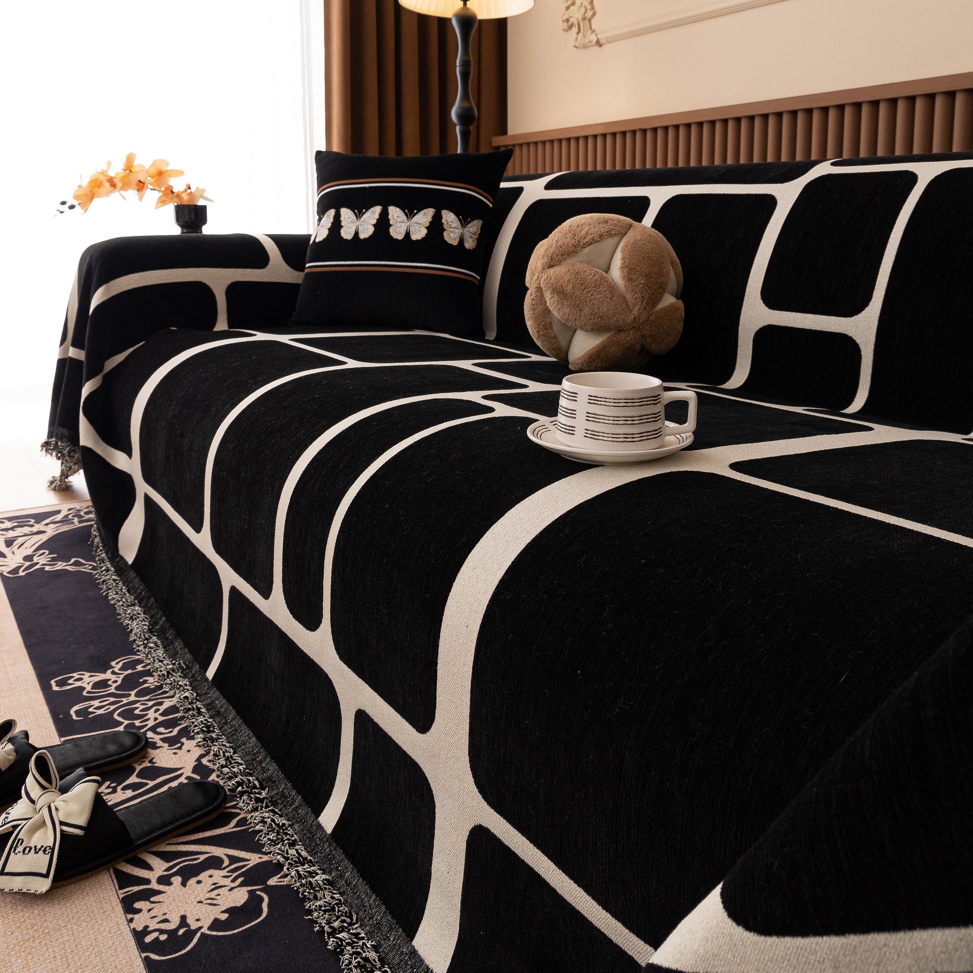 Modern Geometric Sofa Cover Decorative Couch Throw Blanket Furniture Protector with black and white geometric pattern and tassel edges