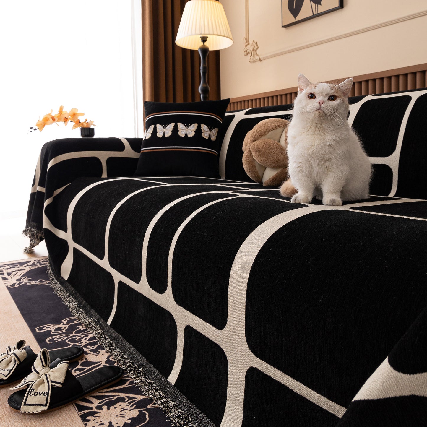 Modern Geometric Sofa Cover Decorative Couch Throw Blanket Furniture Protector on a living room sofa with a cat.