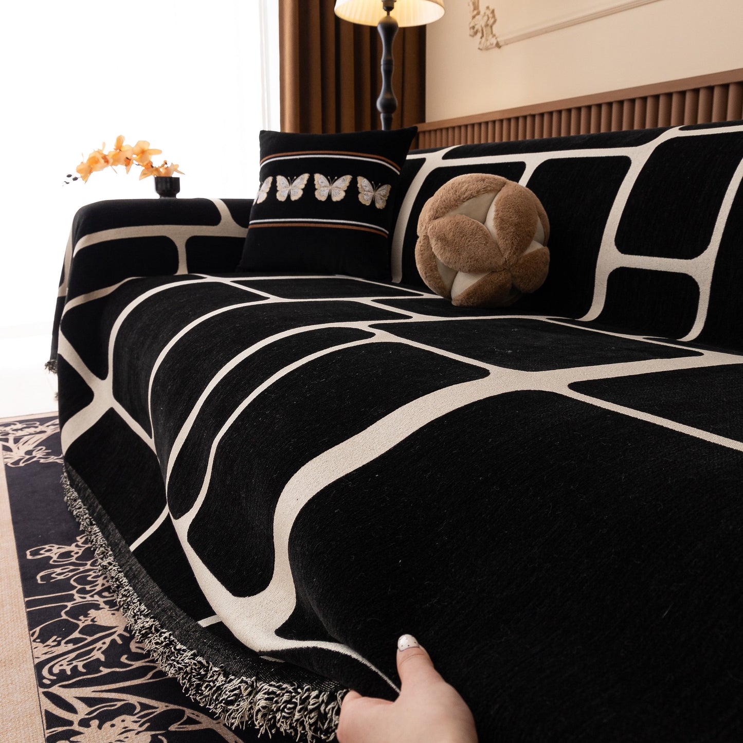 Modern Geometric Sofa Cover Decorative Couch Throw Blanket Furniture Protector in black and white geometric pattern with tassels.