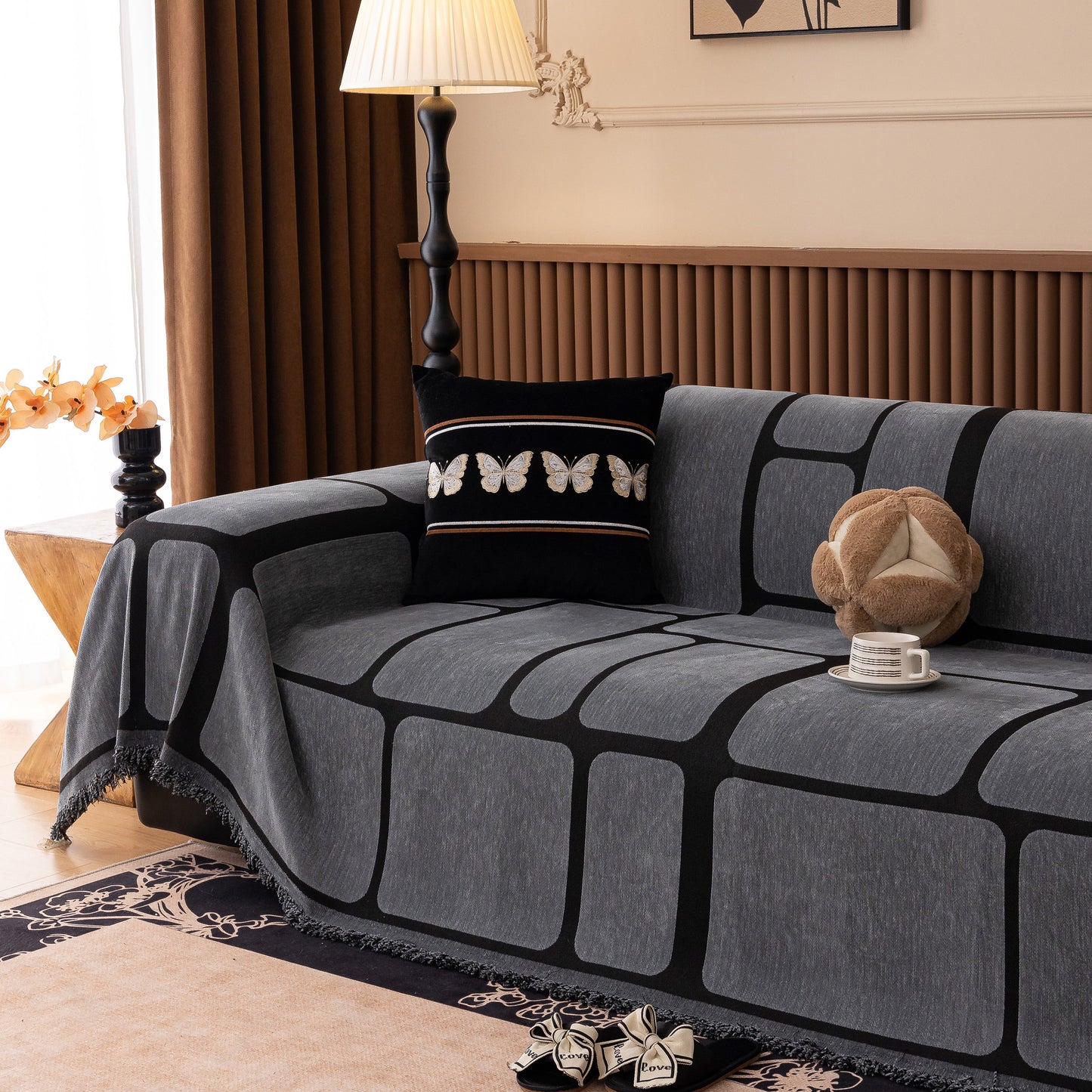 Modern Geometric Sofa Cover Decorative Couch Throw Blanket Furniture Protector with tassel edges on a stylish couch