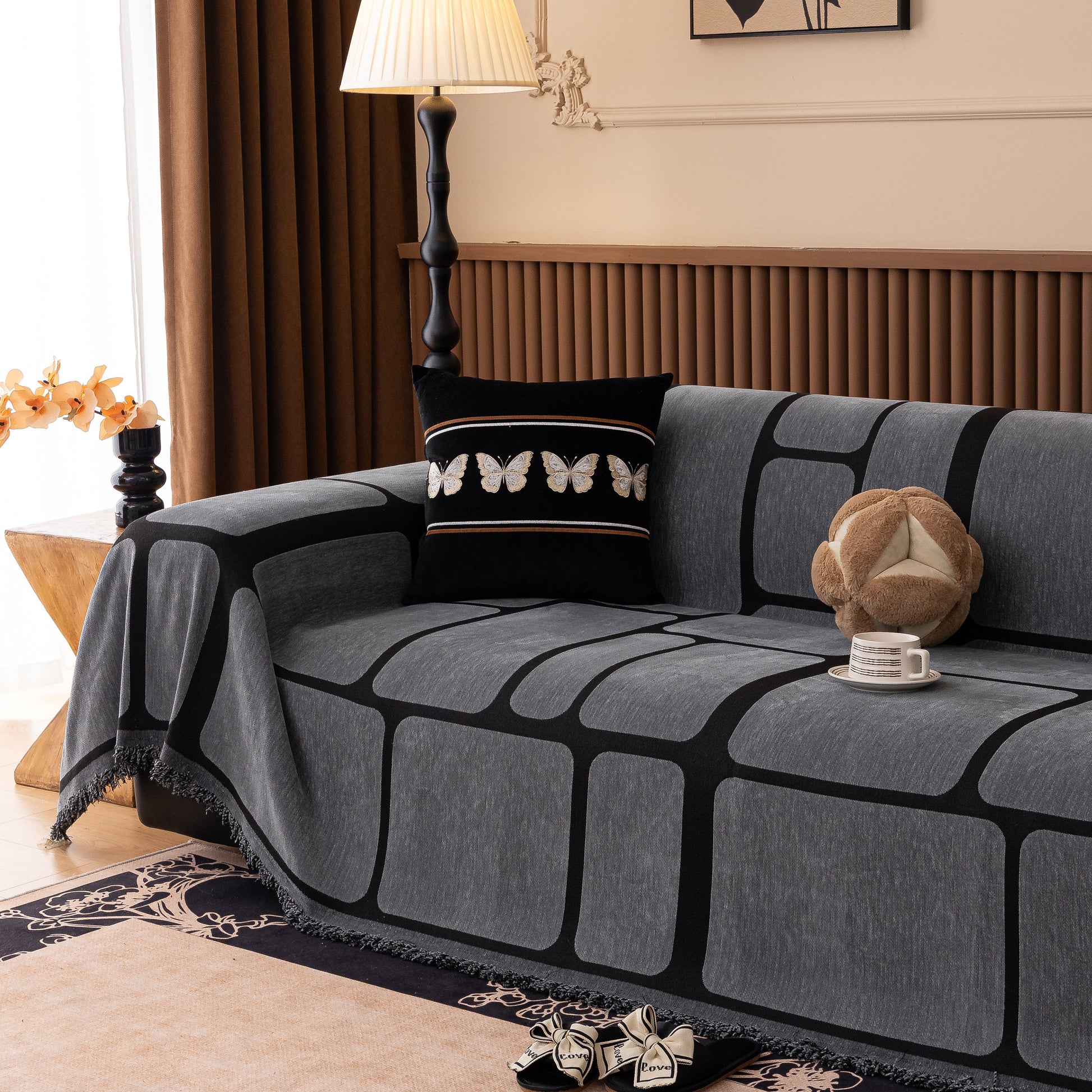 Modern Geometric Sofa Cover Decorative Couch Throw Blanket Furniture Protector with tassel edges on a stylish couch
