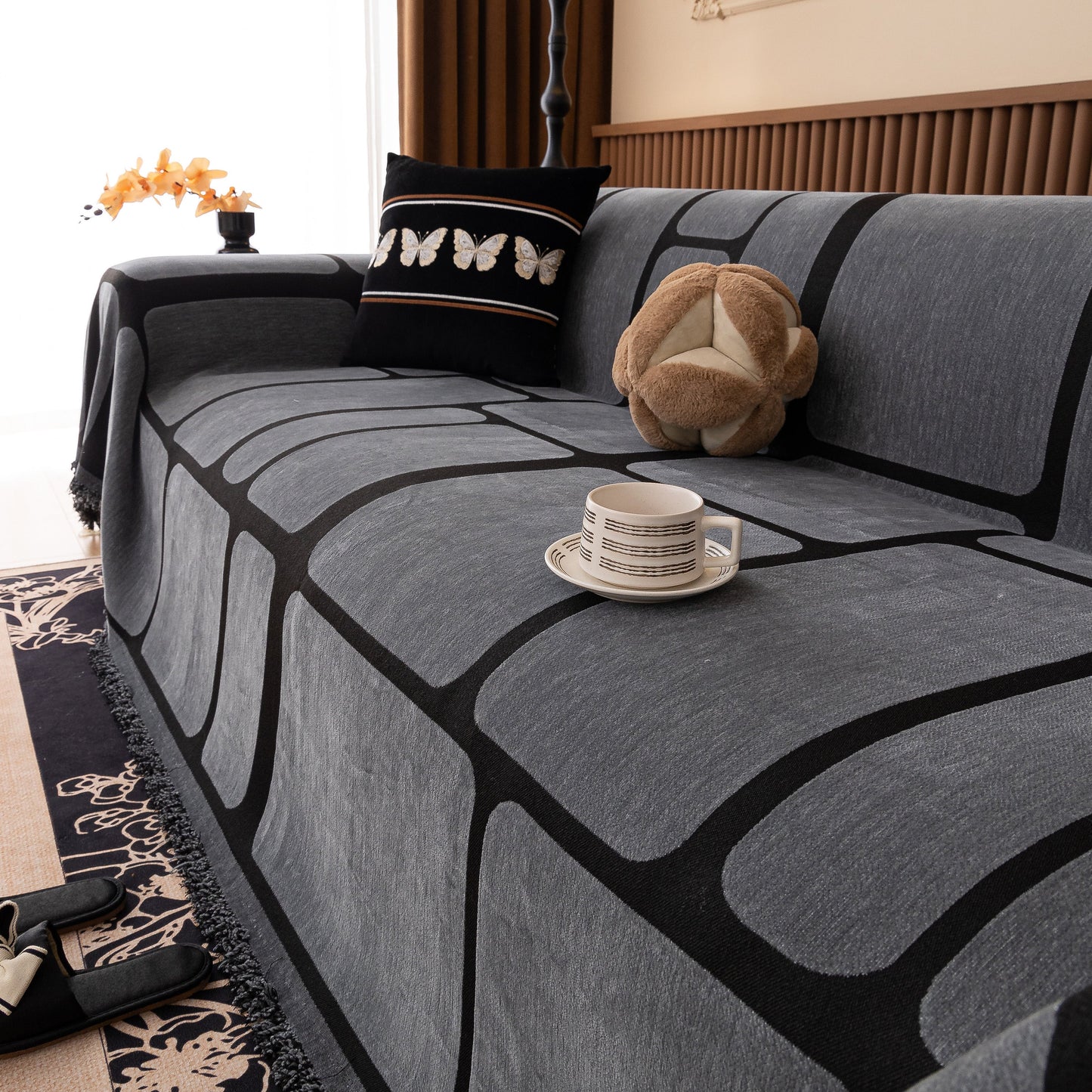 Modern Geometric Sofa Cover Decorative Couch Throw Blanket Furniture Protector on a sofa with a geometric pattern.
