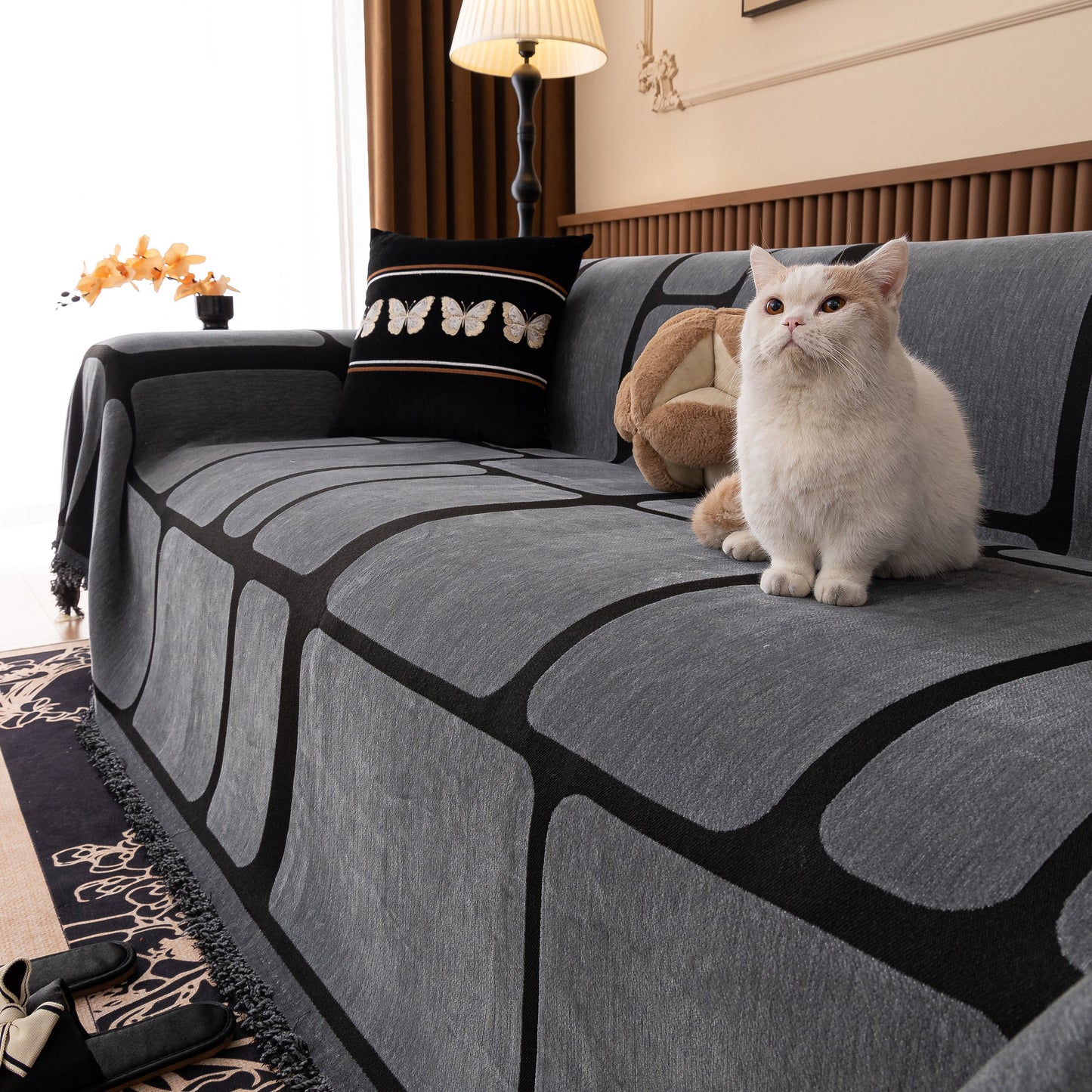 Modern Geometric Sofa Cover Decorative Couch Throw Blanket Furniture Protector with cat sitting on sofa.