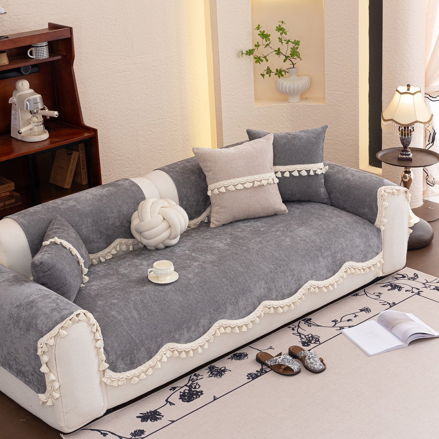 Chenille Sofa Cover Towel – Non-Slip, Washable Pets Couch Protector with Tassels on gray sofa with pillows and decor.