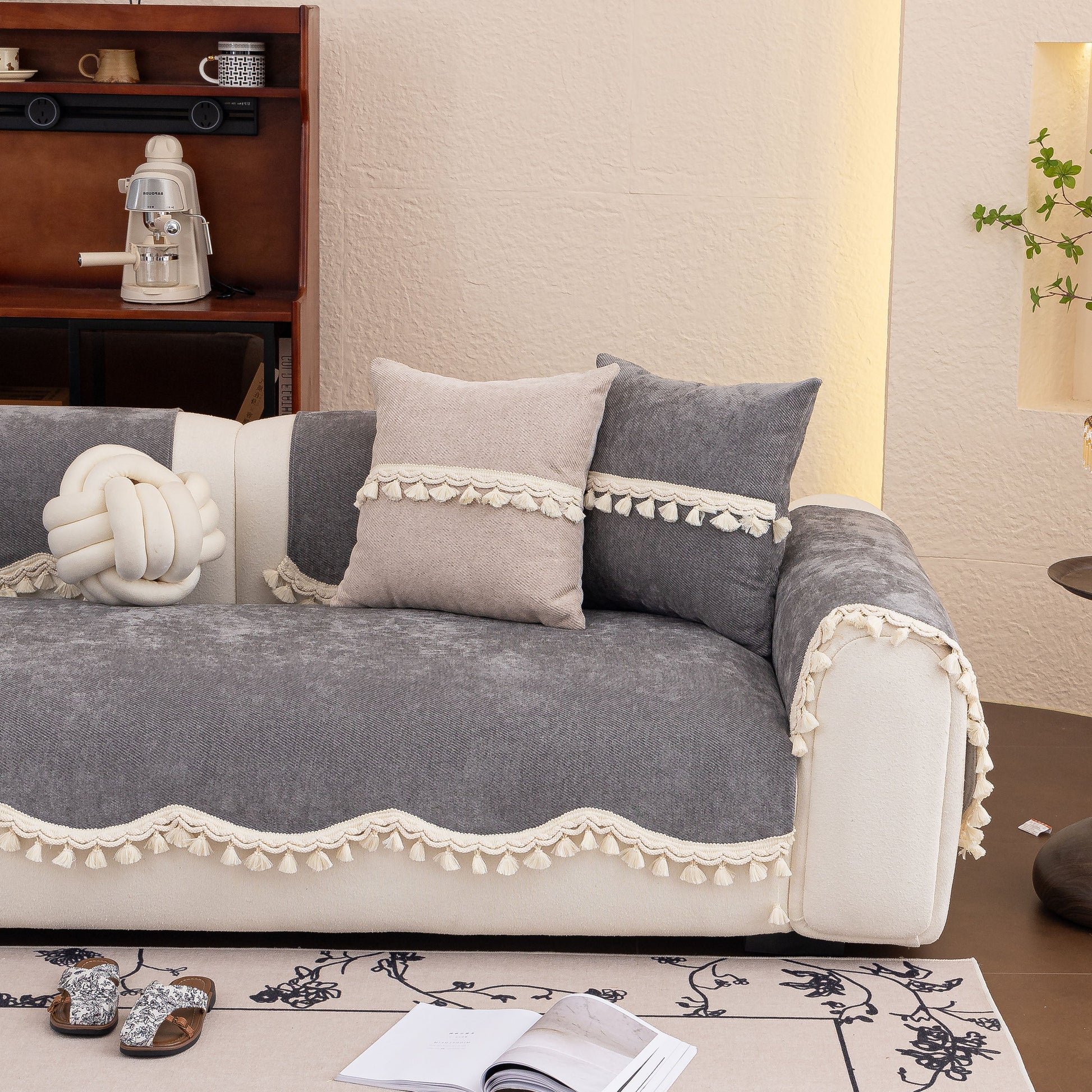 Chenille Sofa Cover Towel – Non-Slip, Washable Pets Couch Protector with Tassels on a modern couch, featuring tassels and braided trim.