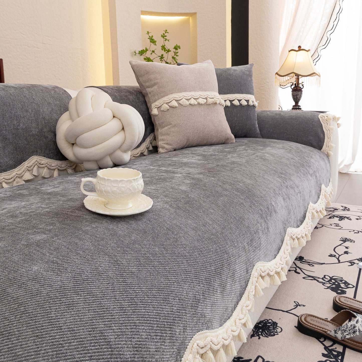 Chenille Sofa Cover Towel – Non-Slip, Washable Pets Couch Protector with Tassels on a cozy living room sofa.