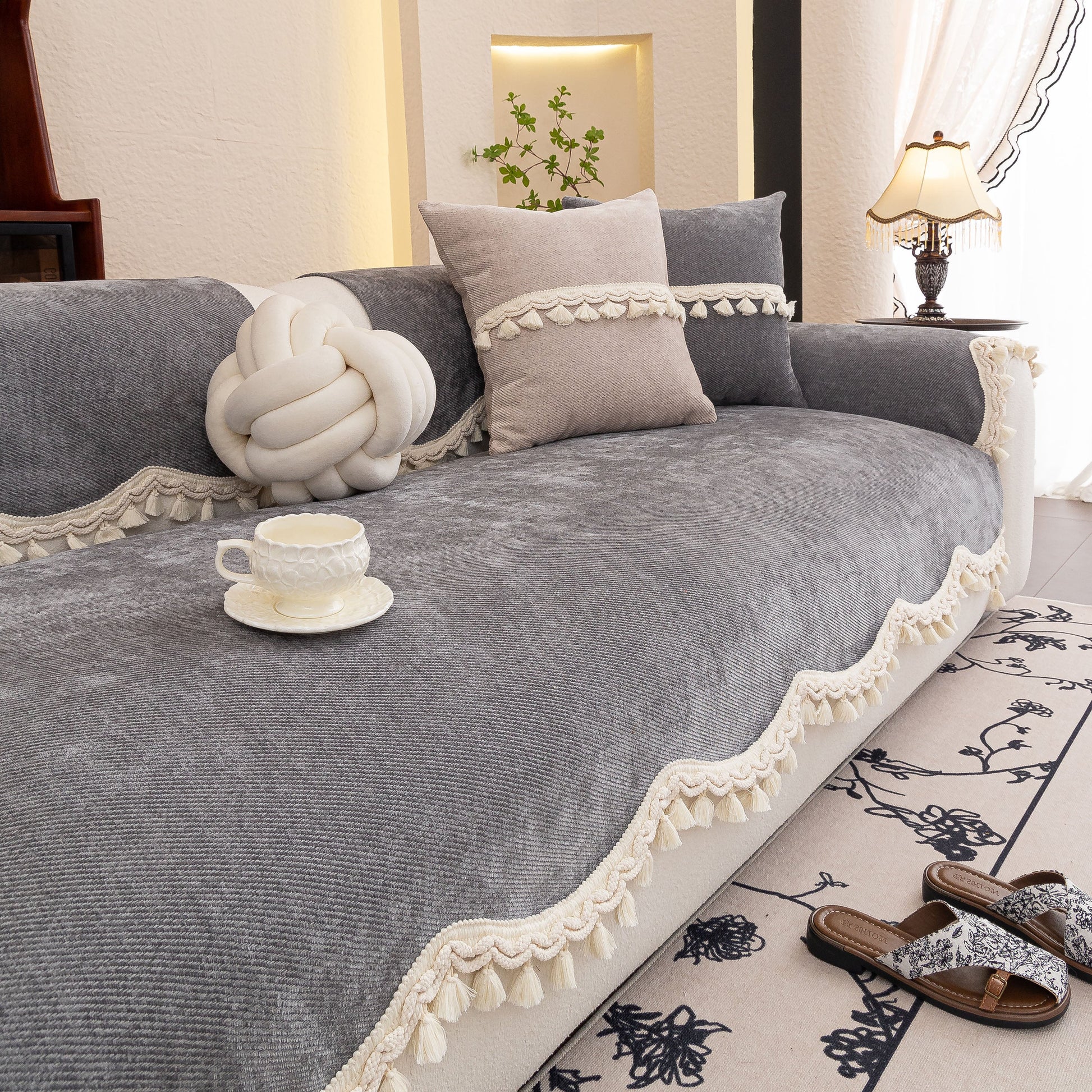 Chenille Sofa Cover Towel – Non-Slip, Washable Pets Couch Protector with Tassels in elegant living room setting.