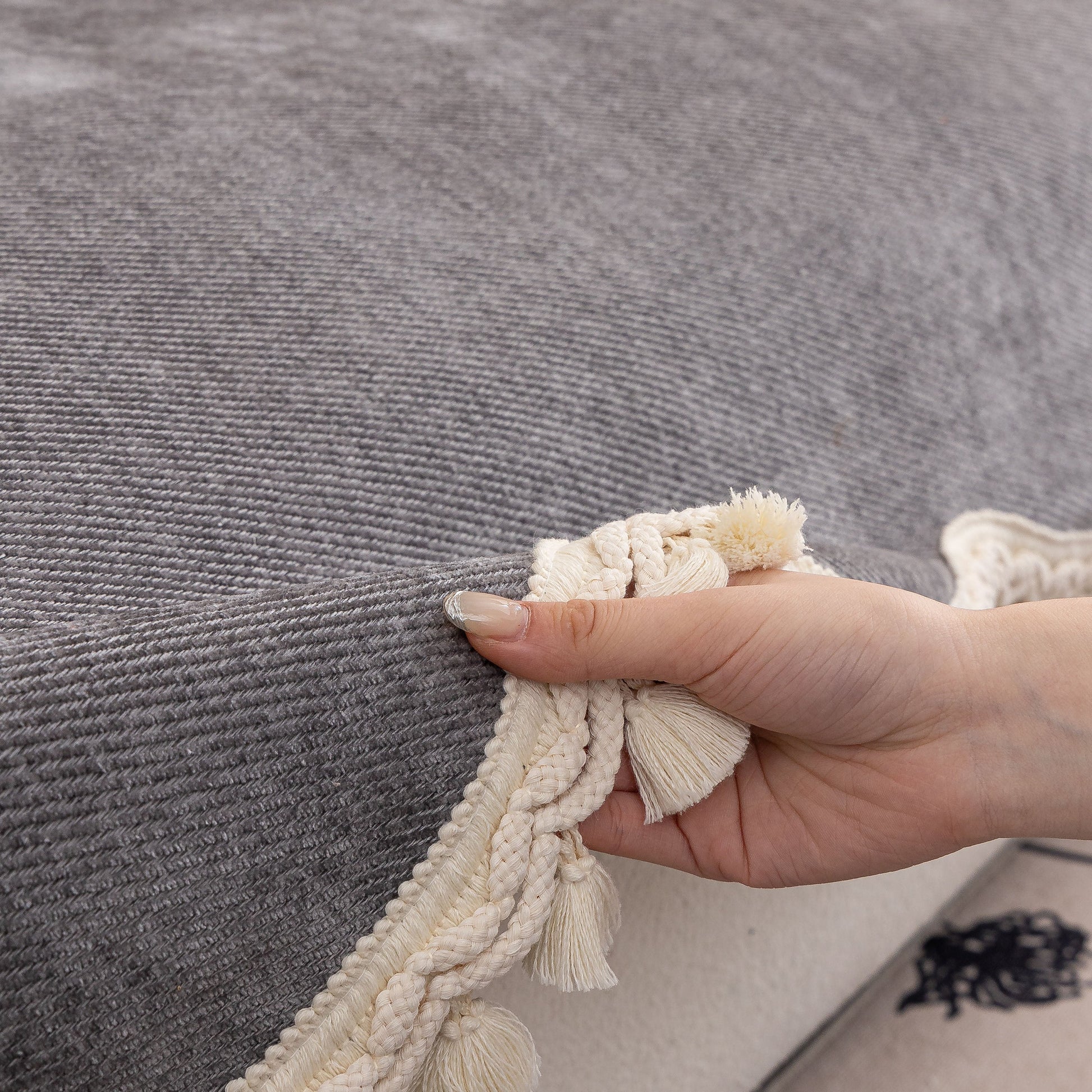 Chenille Sofa Cover Towel – Non-Slip, Washable Pets Couch Protector with Tassels, shown up close with ivory braided trim and tassels.