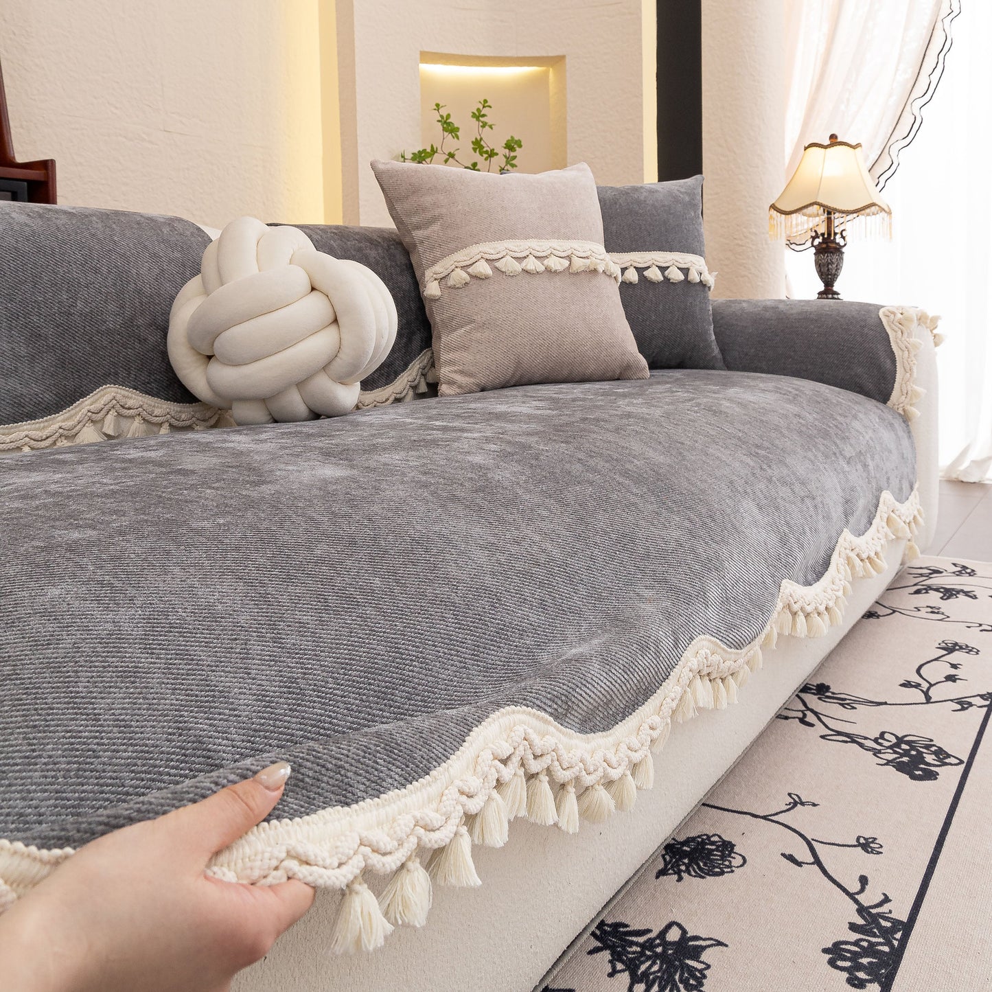 Chenille Sofa Cover Towel – Non-Slip, Washable Pets Couch Protector with Tassels on a modern gray couch