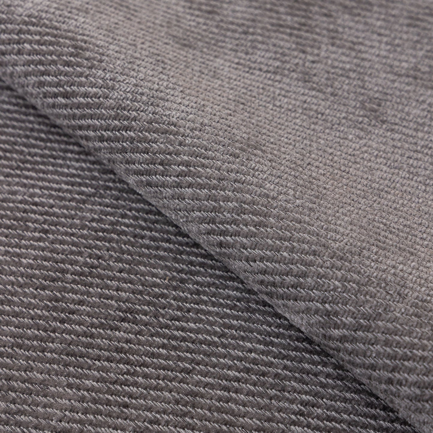 Close-up of gray chenille fabric texture for Chenille Sofa Cover Towel – Non-Slip, Washable Pets Couch Protector with Tassels.