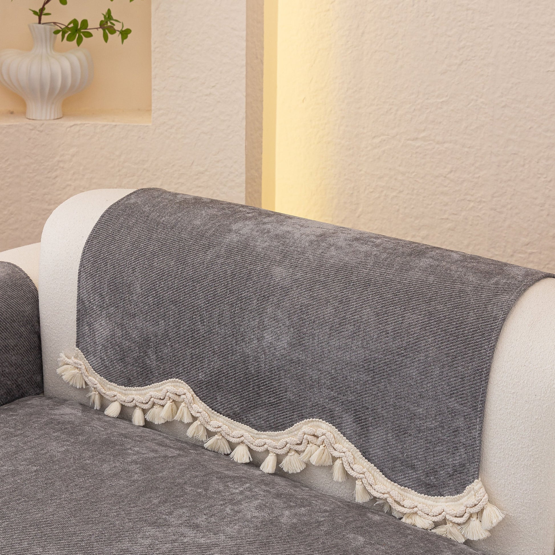 Chenille Sofa Cover Towel – Non-Slip, Washable Pets Couch Protector with Tassels on gray sofa, featuring ivory tassel trim