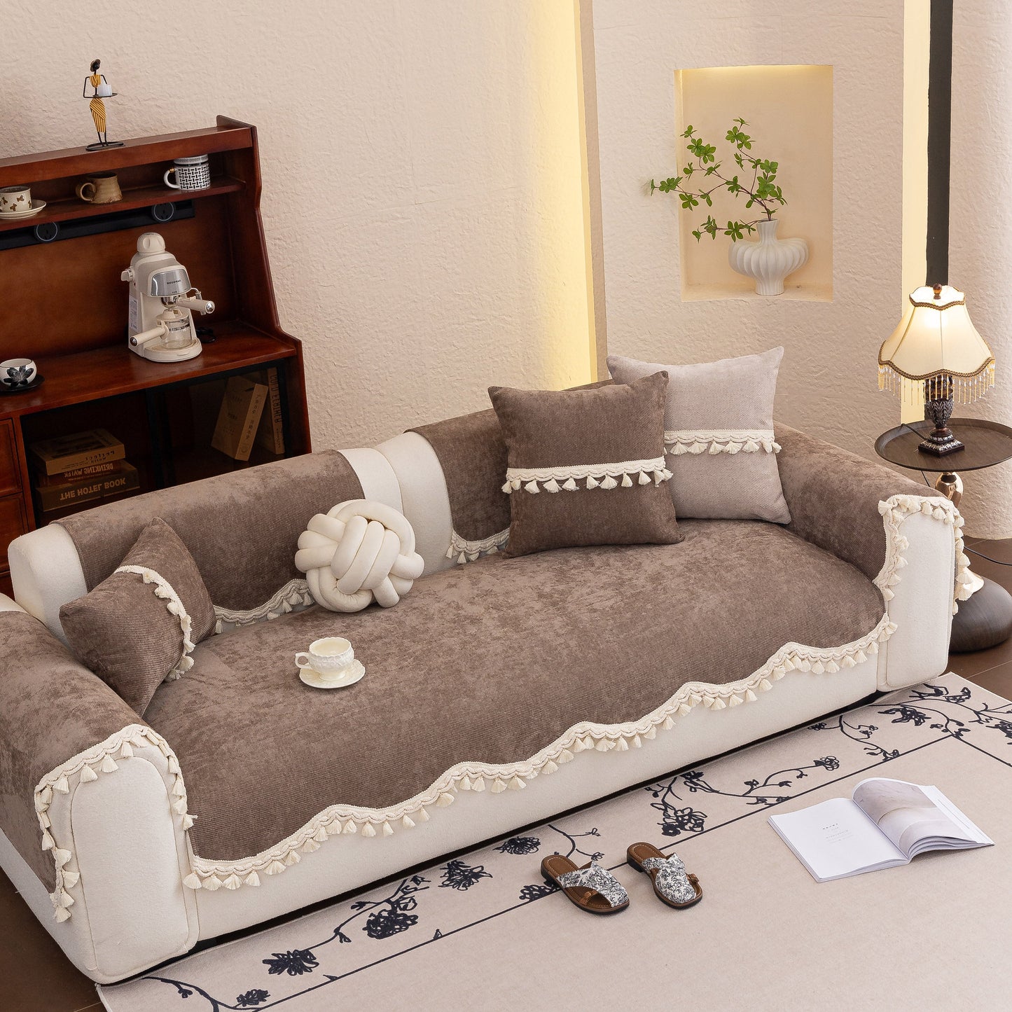 Chenille Sofa Cover Towel – Non-Slip, Washable Pets Couch Protector with Tassels on stylish brown couch with decorative pillows.