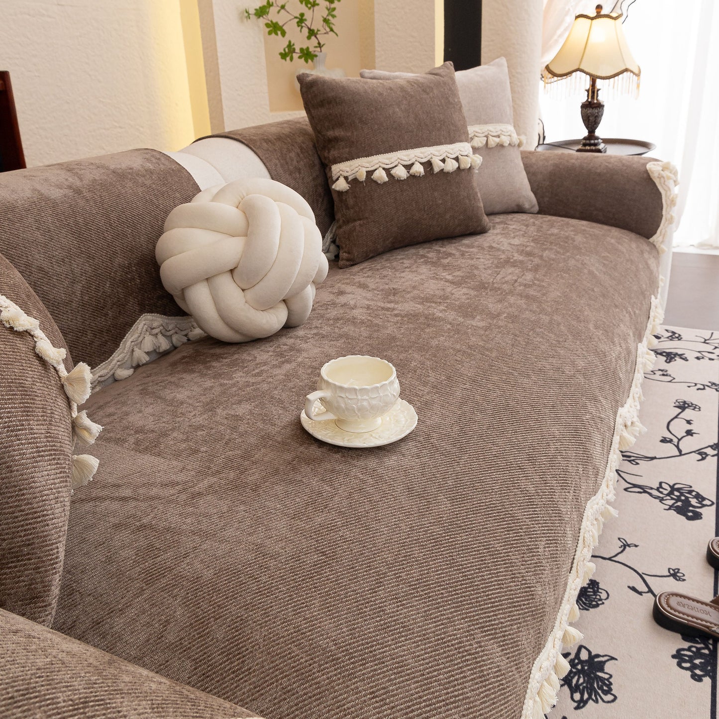 Chenille Sofa Cover Towel – Non-Slip, Washable Pets Couch Protector with Tassels on a cozy living room sofa with decorative pillows.