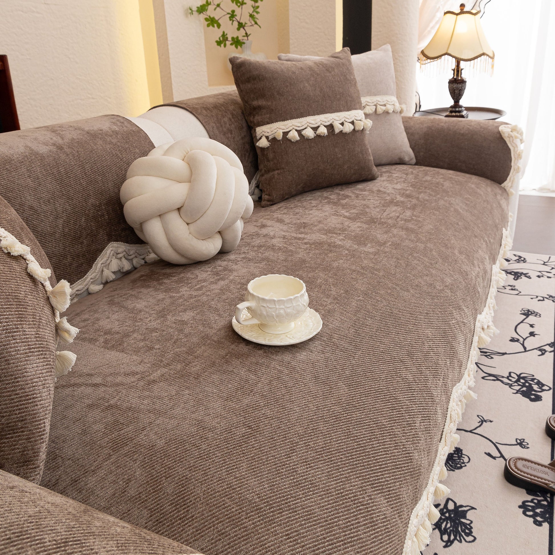 Chenille Sofa Cover Towel – Non-Slip, Washable Pets Couch Protector with Tassels on a cozy living room sofa with decorative pillows.
