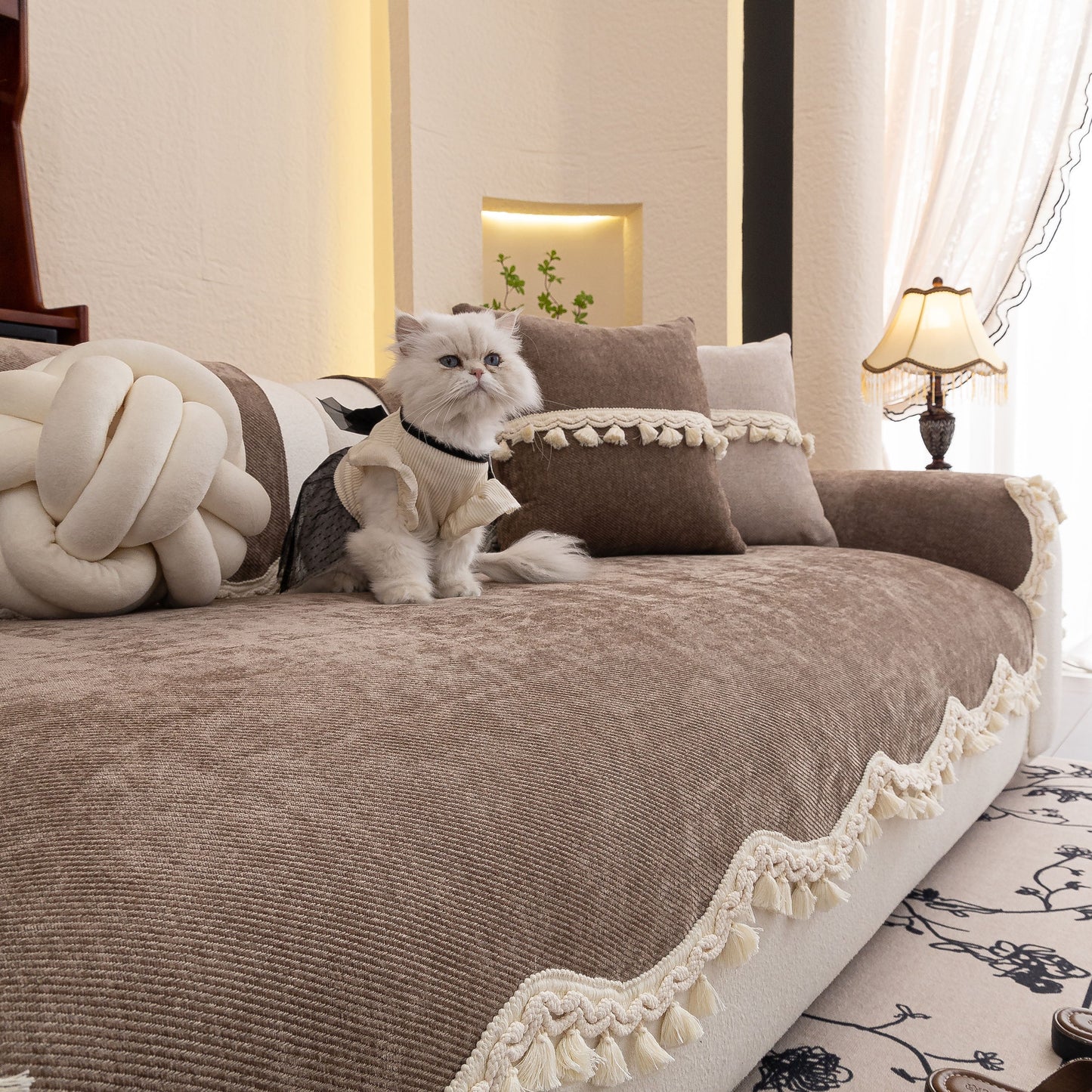 Chenille Sofa Cover Towel – Non-Slip, Washable Pets Couch Protector with Tassels on plush sofa, featuring elegant chenille fabric.