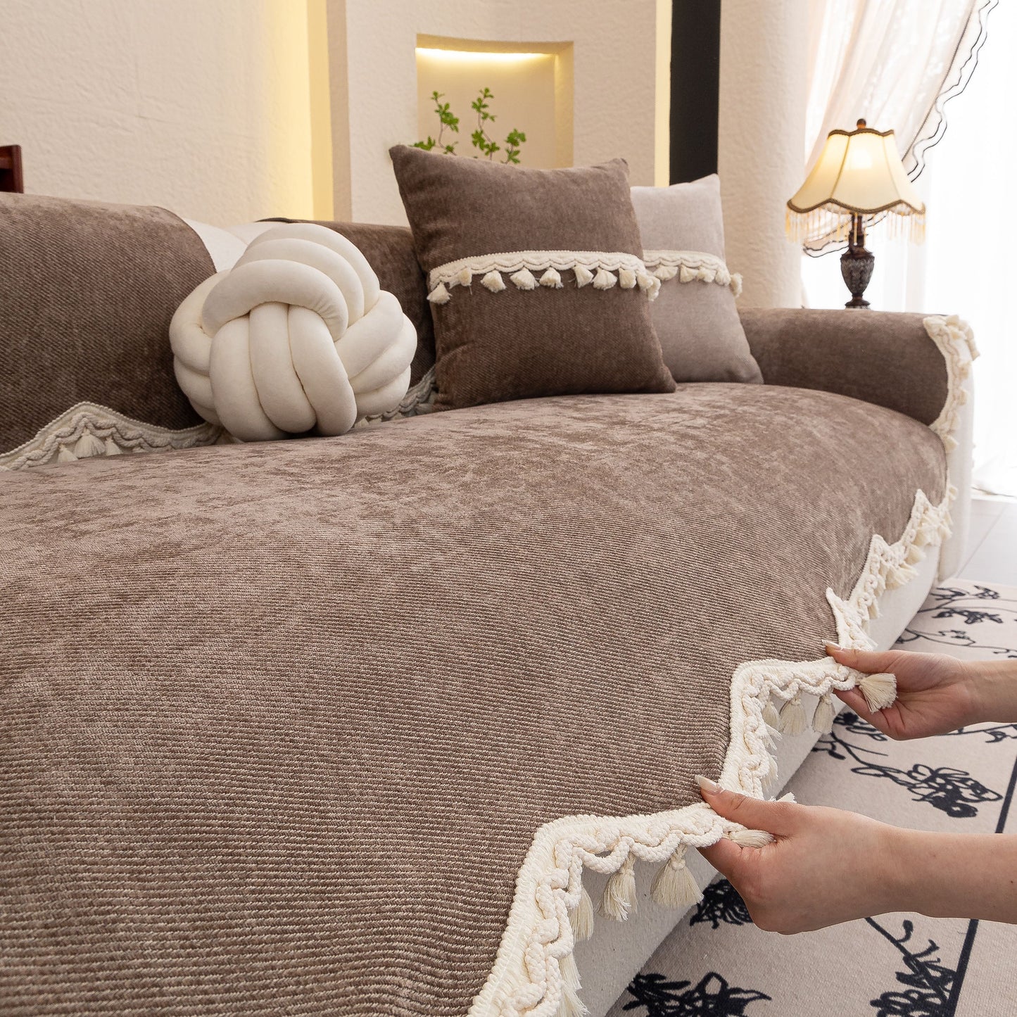Chenille Sofa Cover Towel – Non-Slip, Washable Pets Couch Protector with Tassels on a sofa with decorative cushions