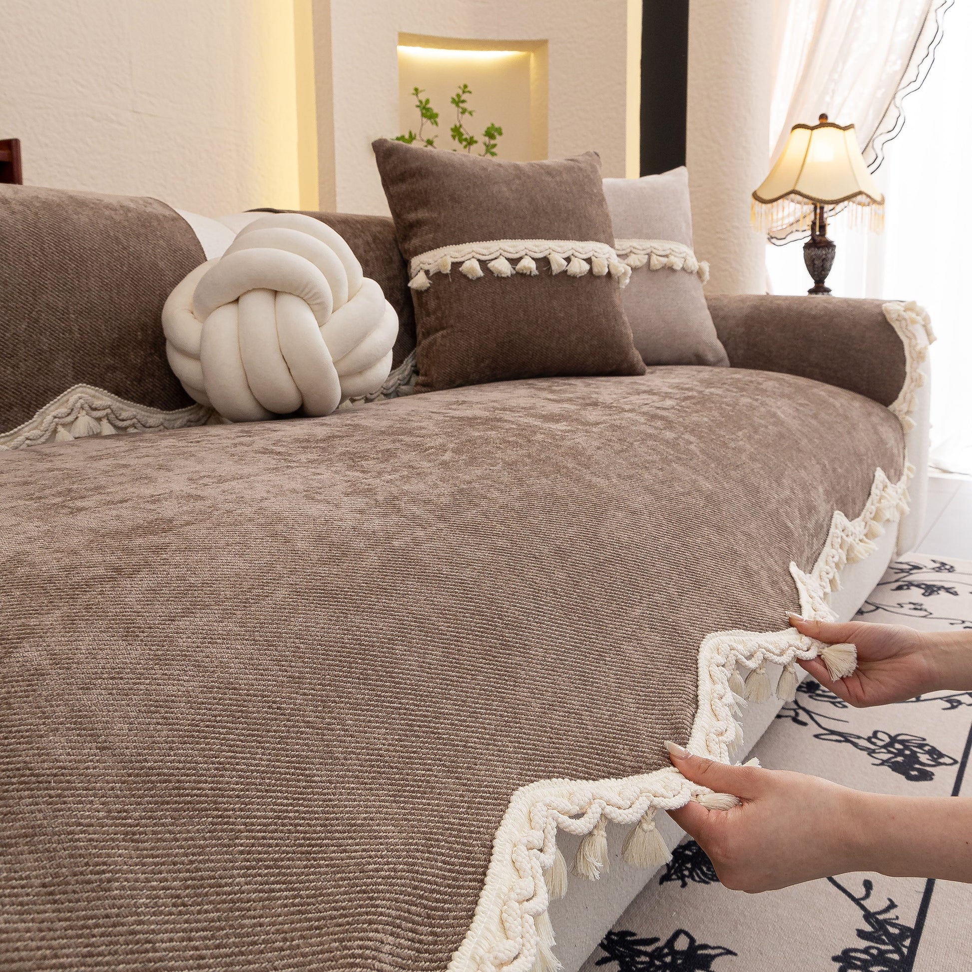 Chenille Sofa Cover Towel – Non-Slip, Washable Pets Couch Protector with Tassels on a sofa with decorative cushions
