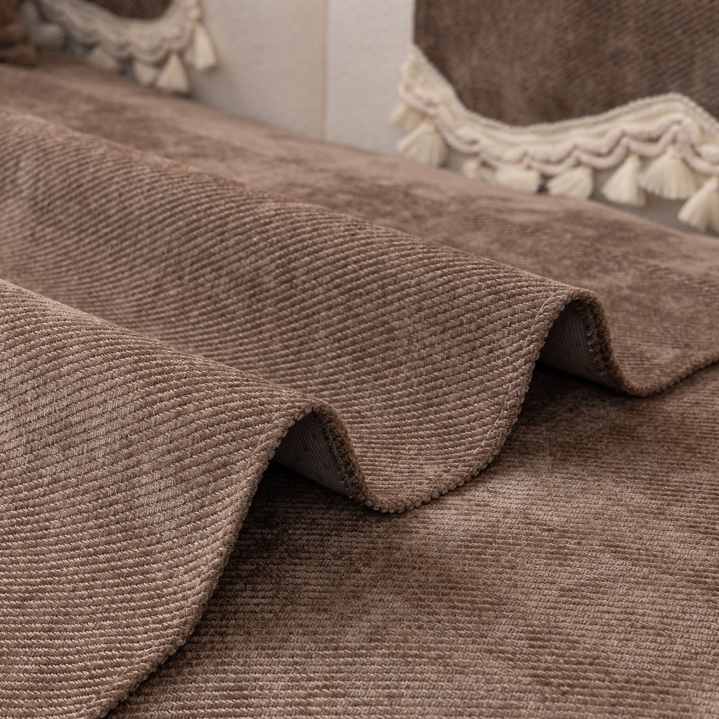 Chenille Sofa Cover Towel – Non-Slip, Washable Pets Couch Protector with Tassels in chenille fabric with braided trim and tassels.