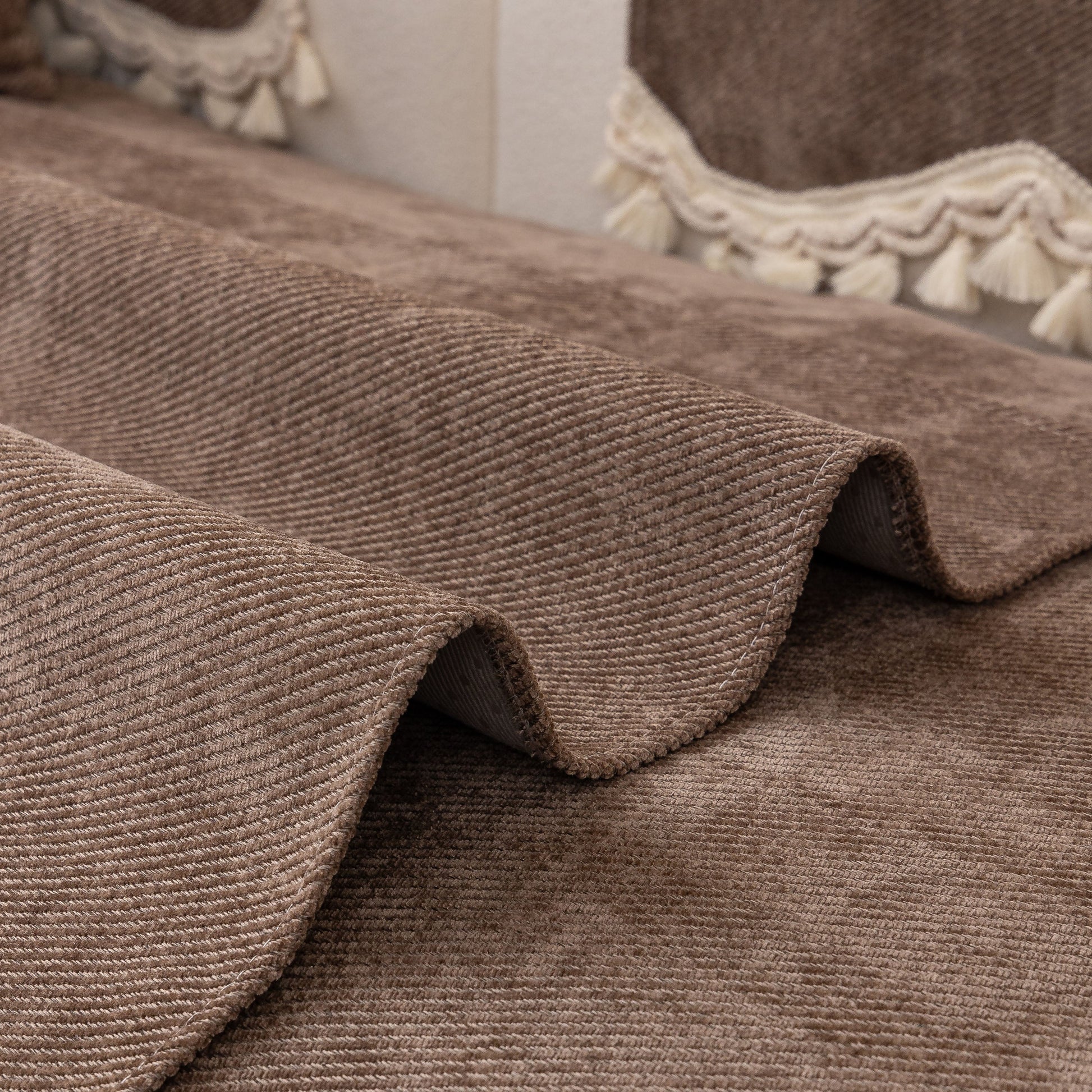 Chenille Sofa Cover Towel – Non-Slip, Washable Pets Couch Protector with Tassels in chenille fabric with braided trim and tassels.