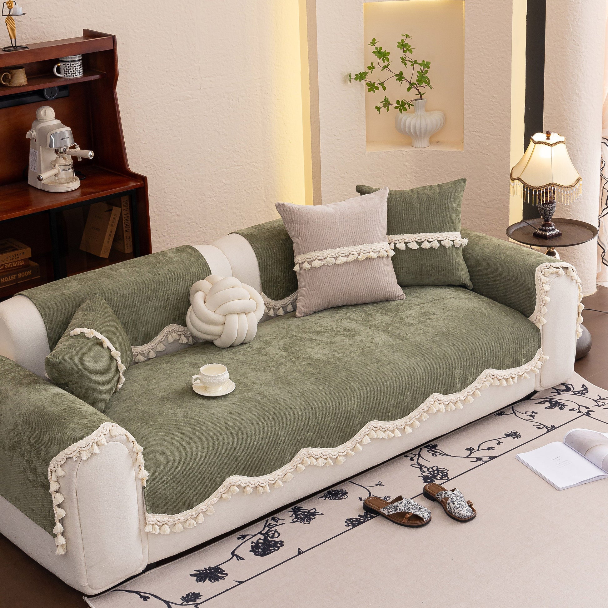 Chenille Sofa Cover Towel – Non-Slip, Washable Pets Couch Protector with Tassels on a modern sofa with decorative pillows.